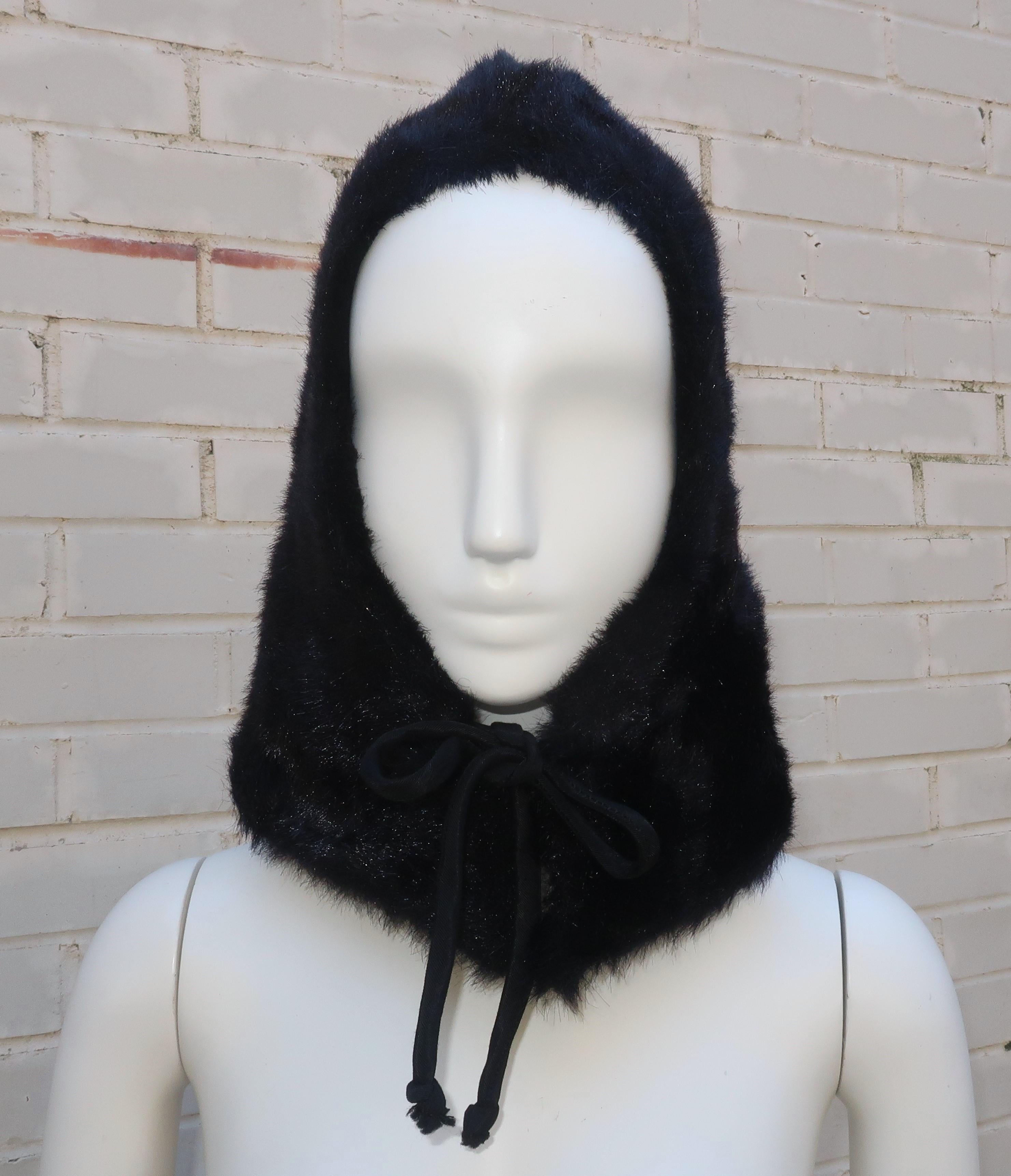 Mod 1960's black faux fur hood with silk faille ties at the front.  The fabulous faux look is actually an easy-to-care-for acrylic that is soft to the touch and drapes easily.  The hood effectively covers the head, ears and neck making it a