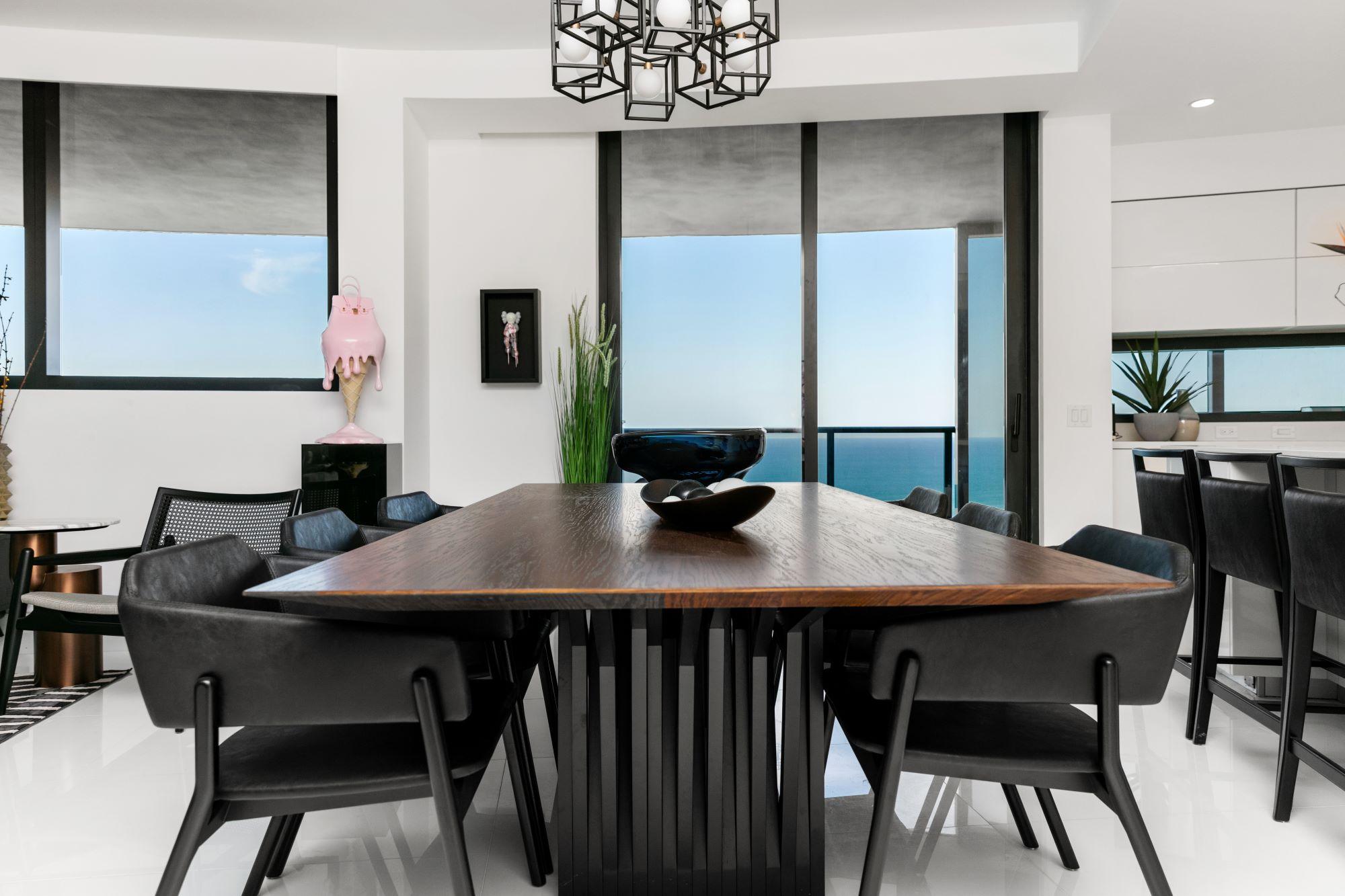 Contemporary Black Faux Leather Armchair with Black Matte Wood Frame, Stuzi Collection For Sale