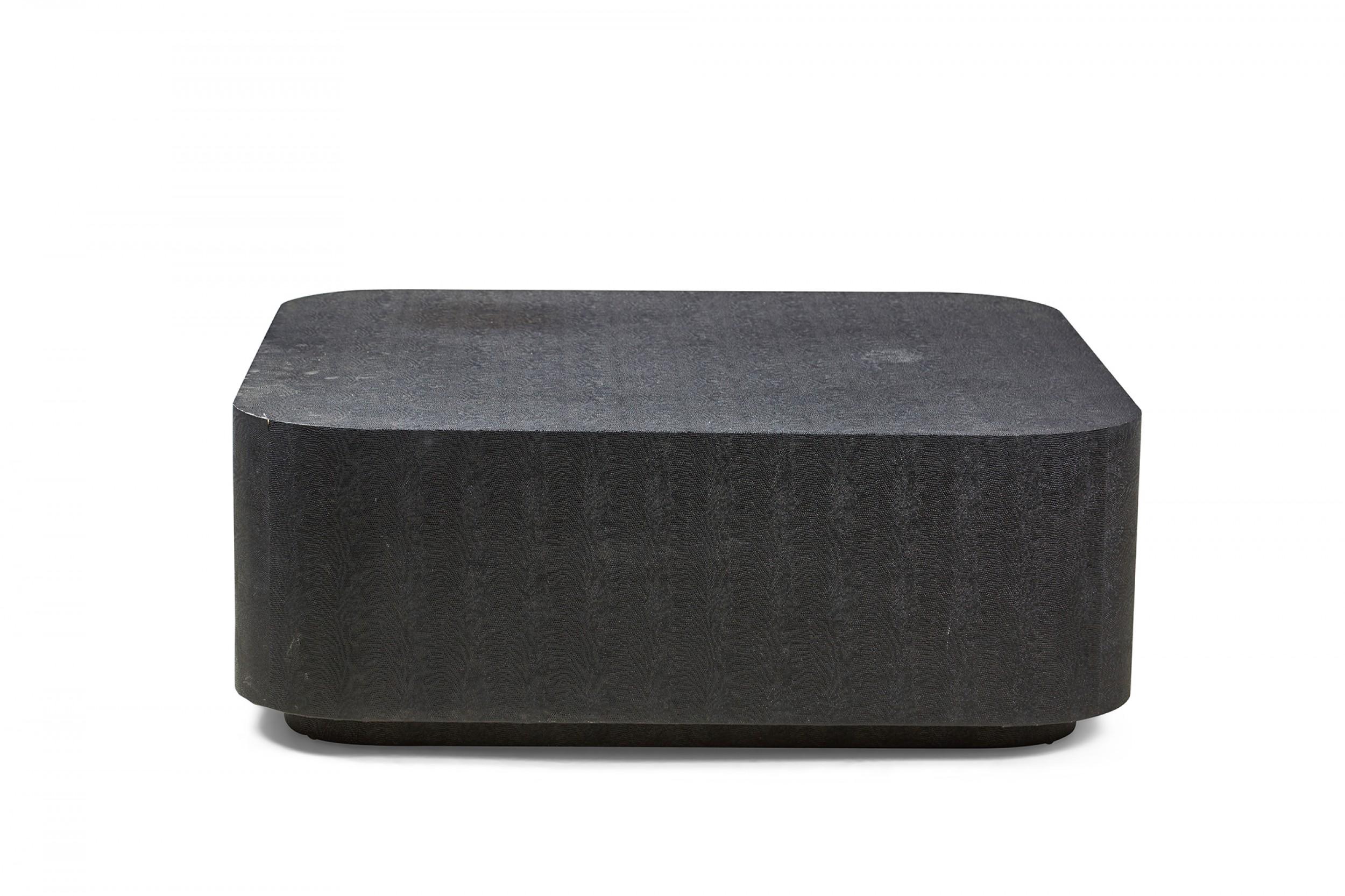 American Mid-Century black faux shagreen wrapped coffee table with a square profile and rounded corners on an inset platform base. (manner of Karl Springer)

