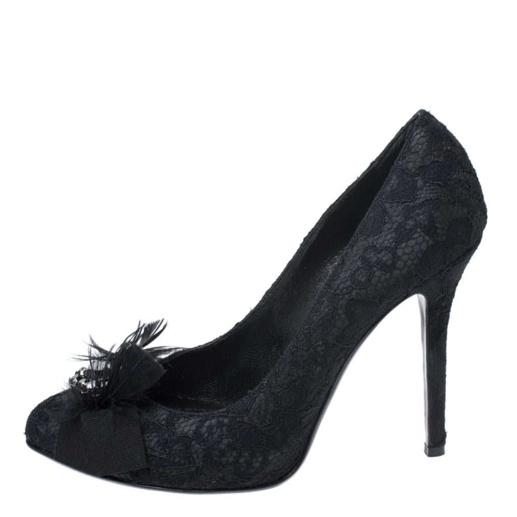 Add this exquisite pair of Dolce & Gabbana pumps for an element of luxury. Match your outfit with these lace and satin of these pumps and complete your look. They feature feather and crystals on the uppers and are set on 11.5 cm heels.

Includes: