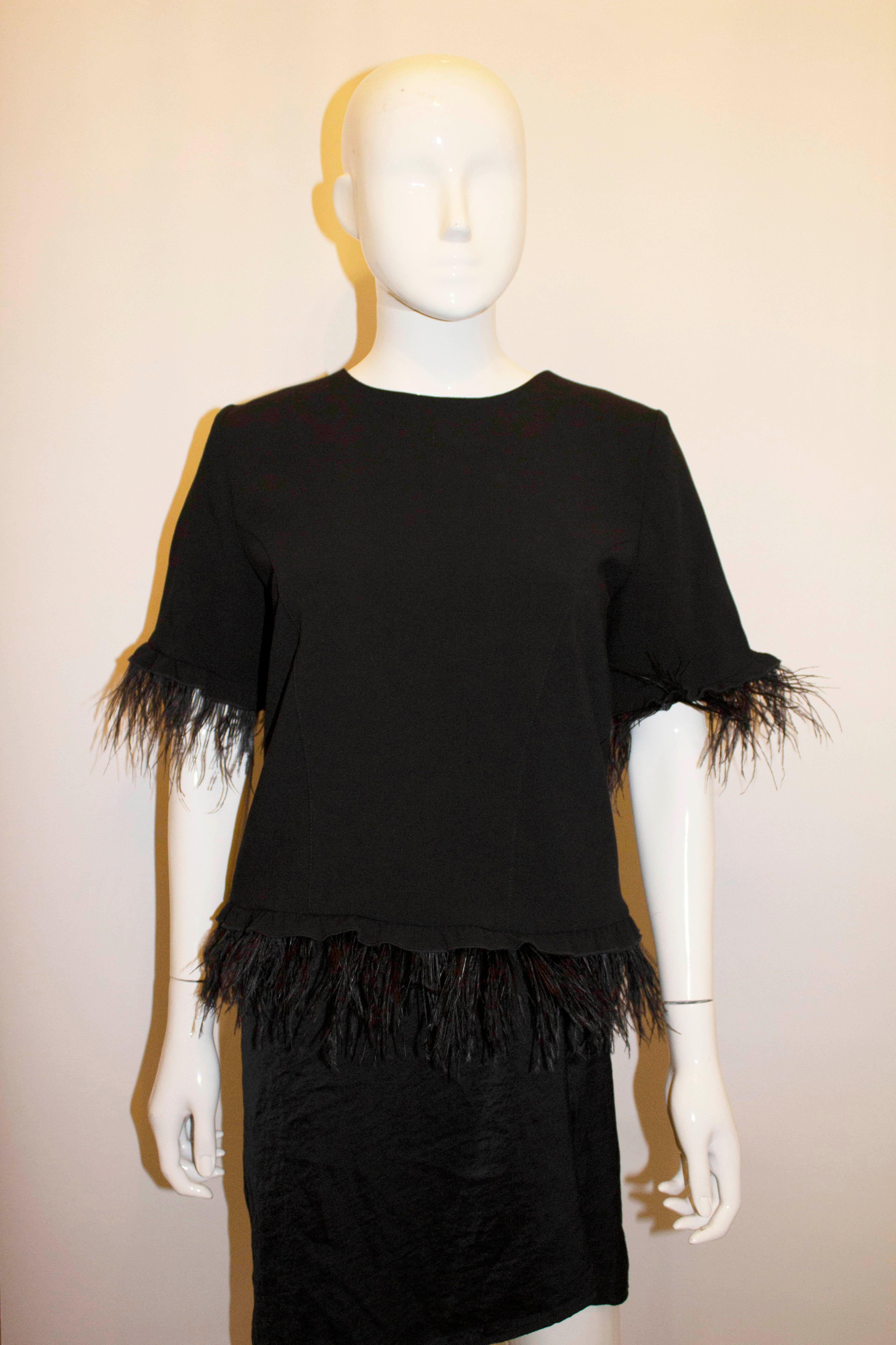 black feather blouse