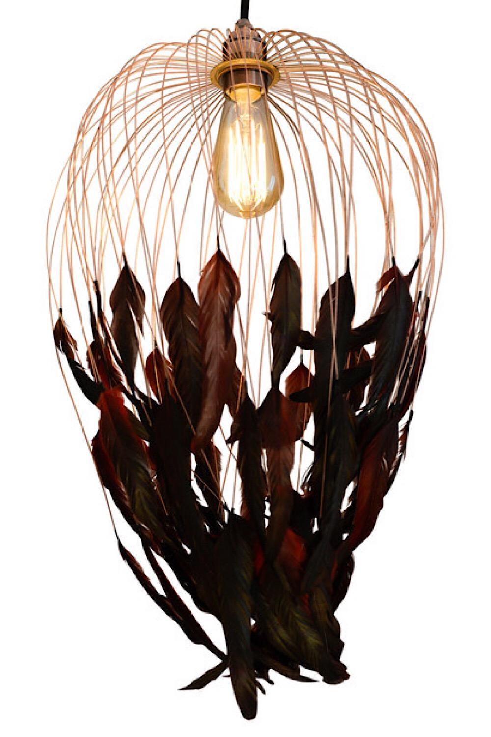 Feather chandelier pendant made of a metal structure and rooster tail feathers.
 
