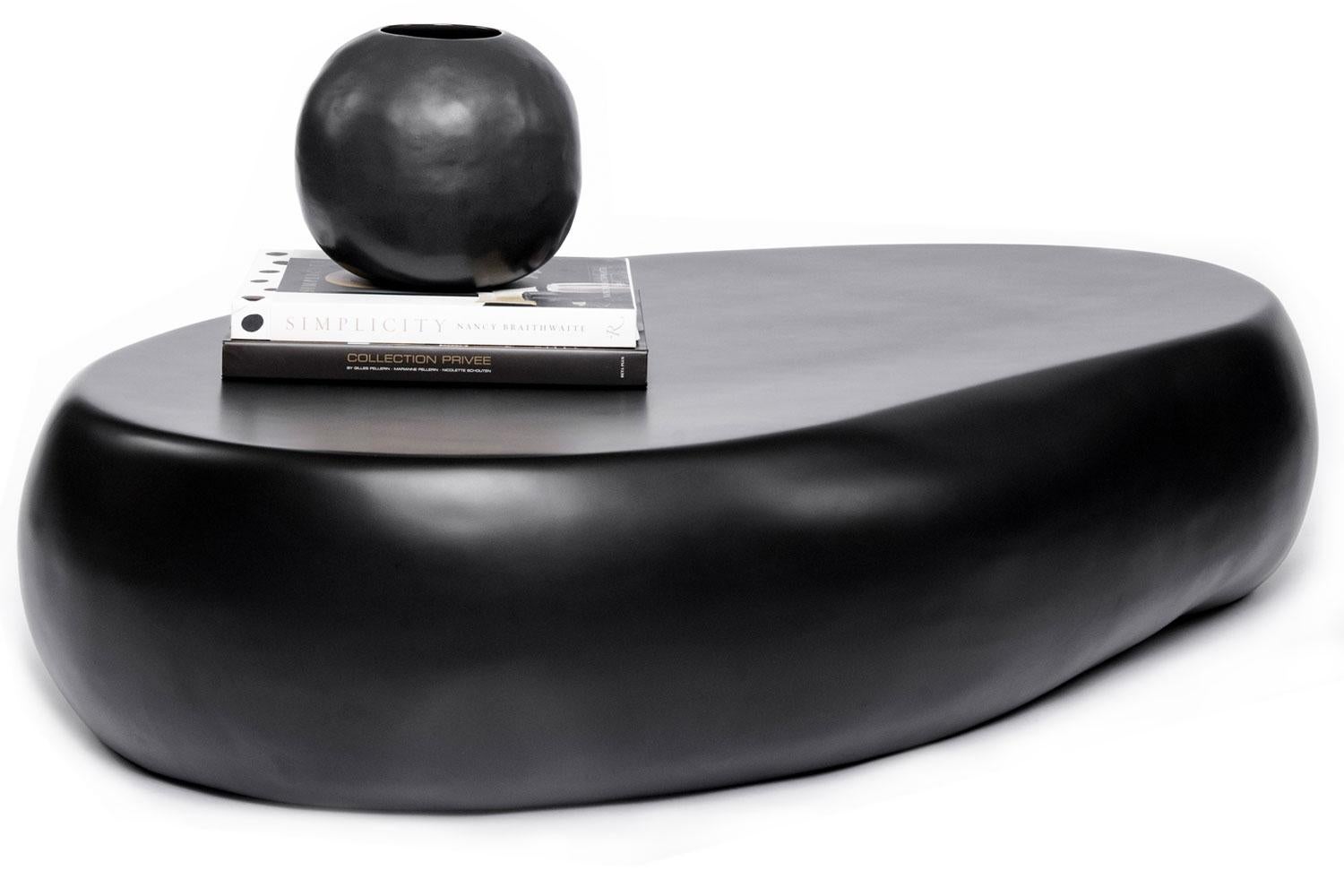 Slab coffee table By Imperfetto

Made in Italy and designed by Verter Turroni, this Slab coffee table has a rounded smooth profile and shape. Made from black cast fiberglass this elegant surface is durable. Modern in design and an organic feel