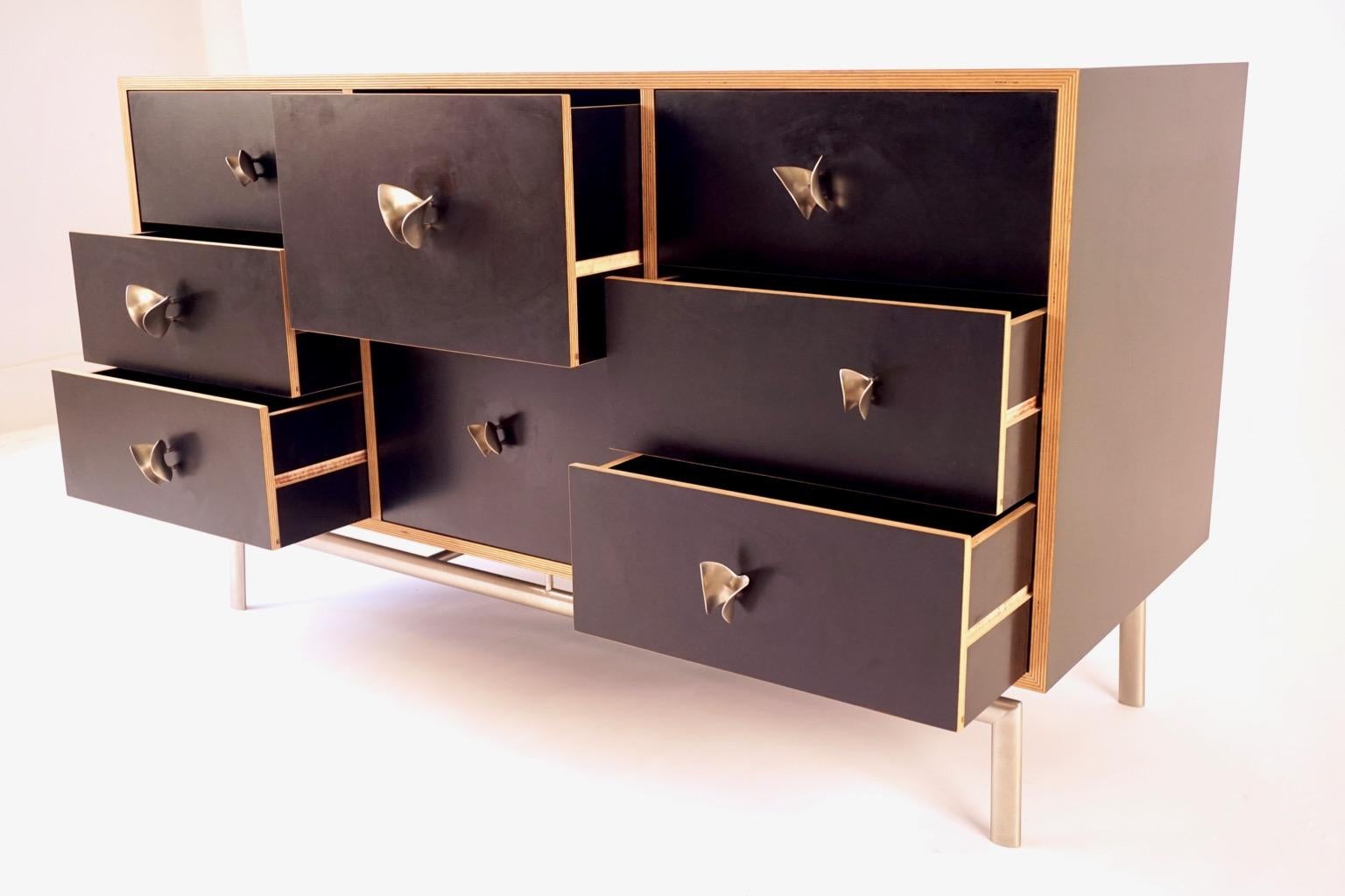 The butterfly cabinet is one of a group of pieces Lehrecke designed while working with the E.R.Butler hardware company in 2009. Most of the pieces involved knobs of his own design for the company, but in this piece we used the Ted Muehling designed