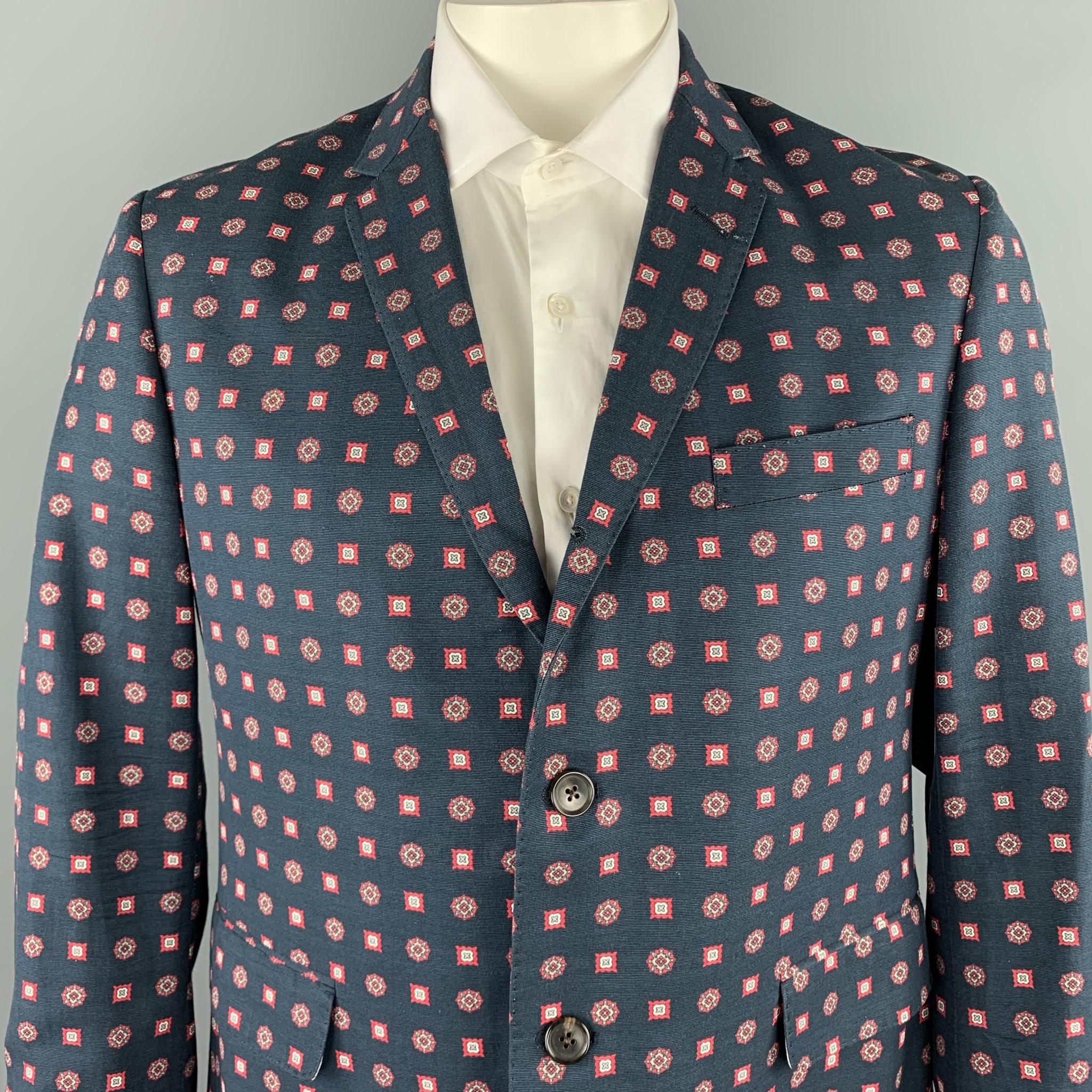 BLACK FLEECE sport coat comes in a navy print cotton / viscose with a stripe liner featuring a notch lapel, flap pockets, and a three button closure. 

Very Good Pre-Owned Condition.
Marked: BB3

Measurements:

Shoulder: 18 in. 
Chest: 42 in. 