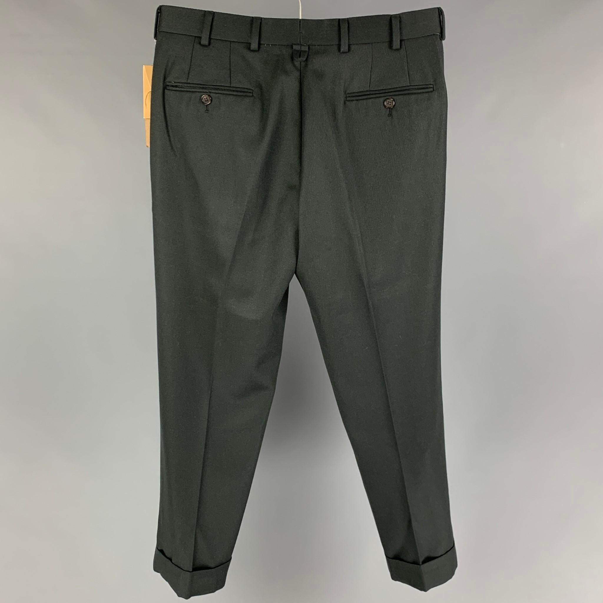 BLACK FLEECE dress pants comes in a forest green wool featuring a flat front, cuffed leg, front tab, and a button fly closure. 

New with tags.
Marked: BB2

Measurements:

Waist: 34 in.
Rise: 10.5 in.
Inseam: 29 in.