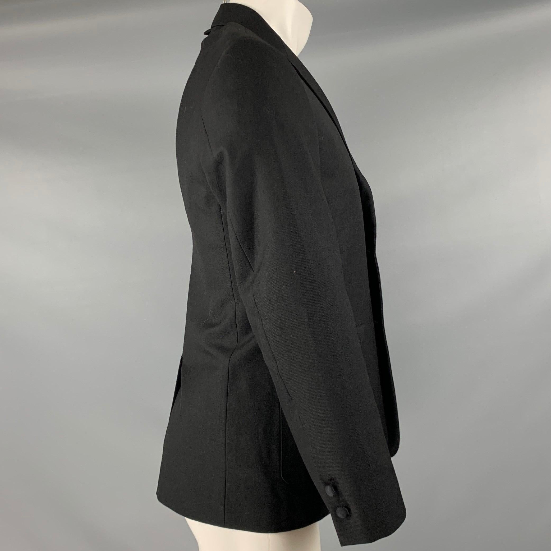 BLACK FLEECE by THOM BROWNE sport coat
in a black wool twill fabric featuring notch lapel, single vented back, and three button closure. Made in USA.Excellent Pre-Owned Condition. 

Marked:   BB1 

Measurements: 
 
Shoulder: 16.5 inches Chest: 38