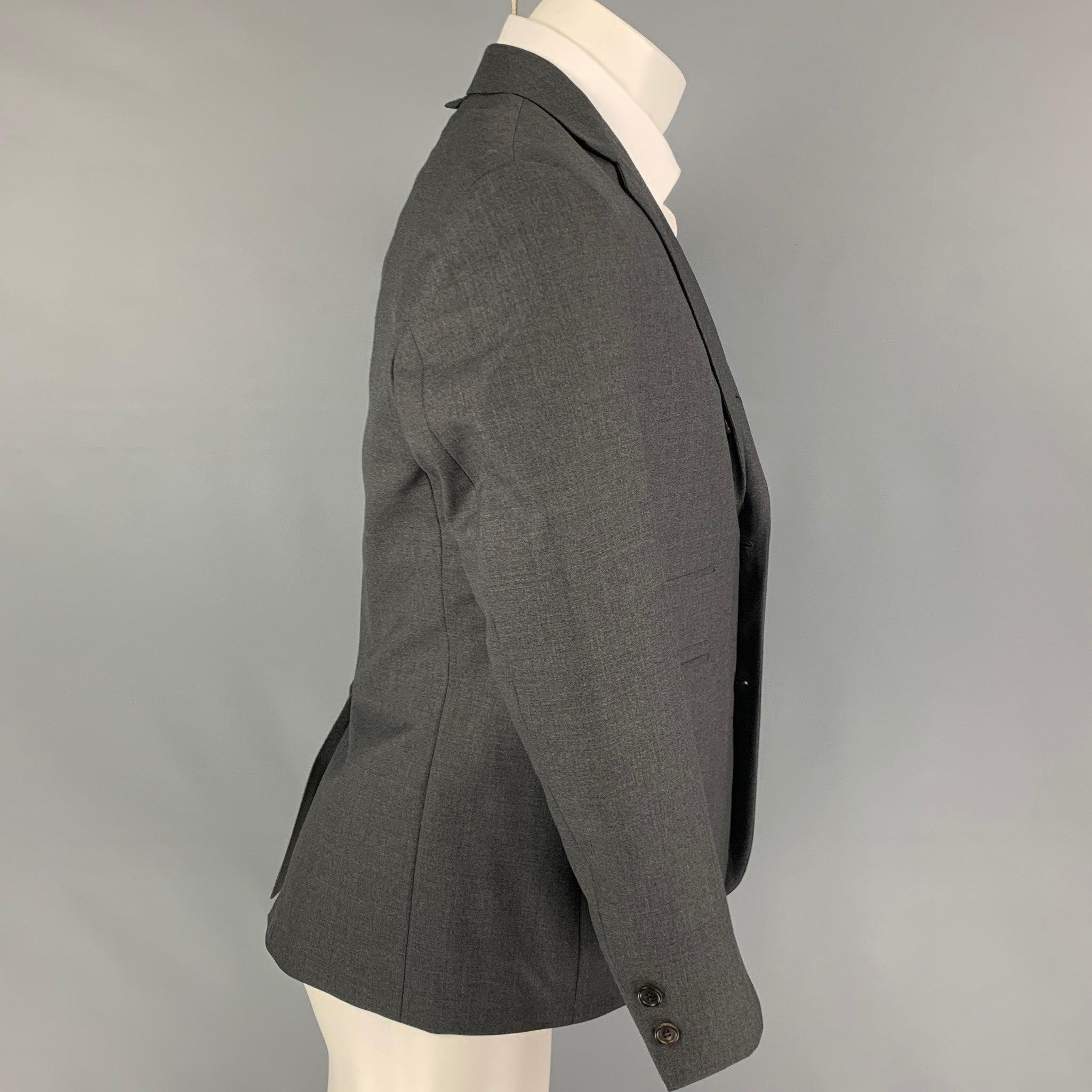 BLACK FLEECE sport coat comes in a dark gray wool with a full liner featuring a notch lapel, flap pockets, single back vent, and a double button closure. Made in USA.
Very Good
Pre-Owned Condition.  

Marked:   BB1  

Measurements: 
 
Shoulder:
18