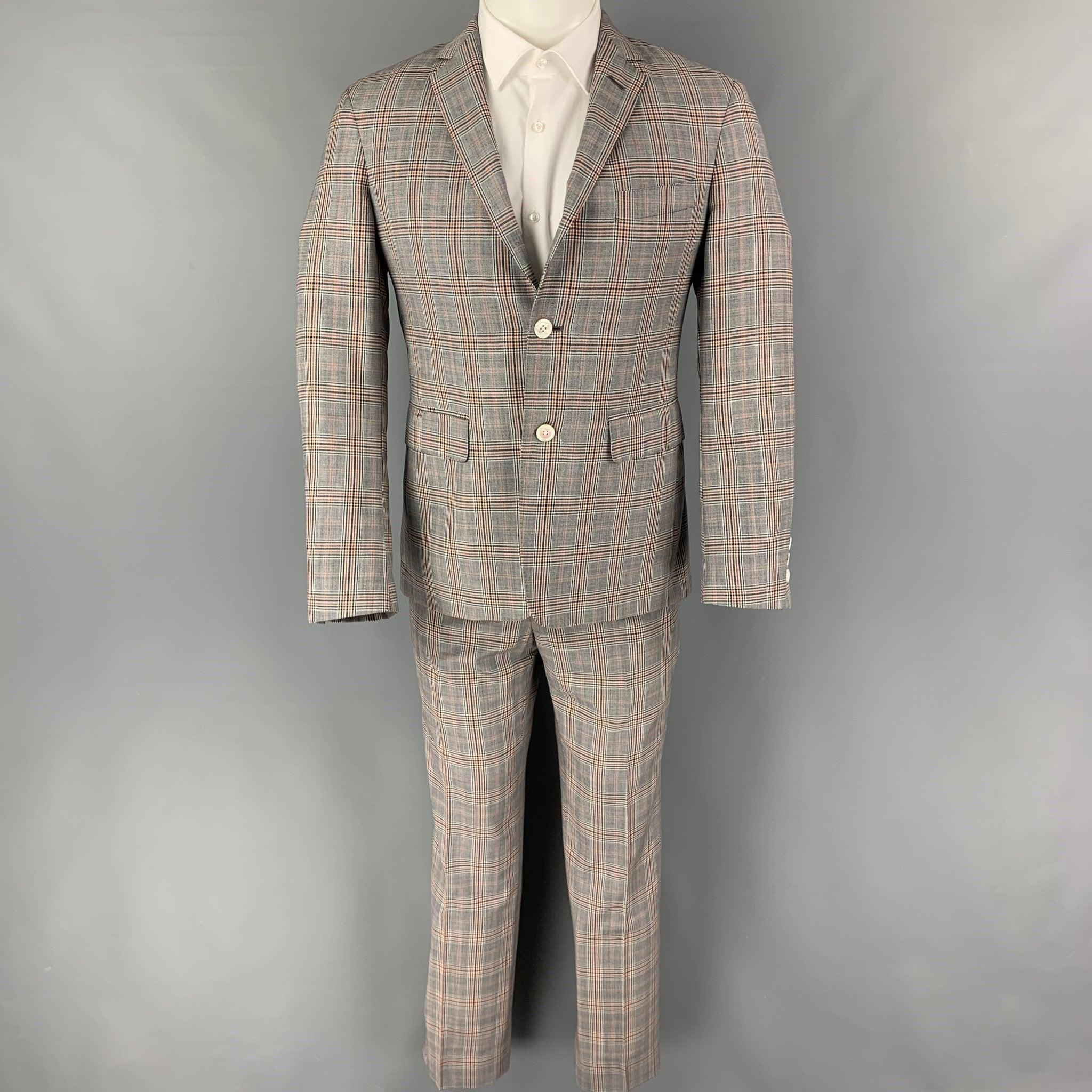 BLACK FLEECE
suit comes in a grey & navy plaid wool and includes a single breasted, three button sport coat with a notch lapel and matching flat front trousers. Very Good Pre-Owned Condition. 

Marked:   BB1  

Measurements: 
  -JacketShoulder: 18