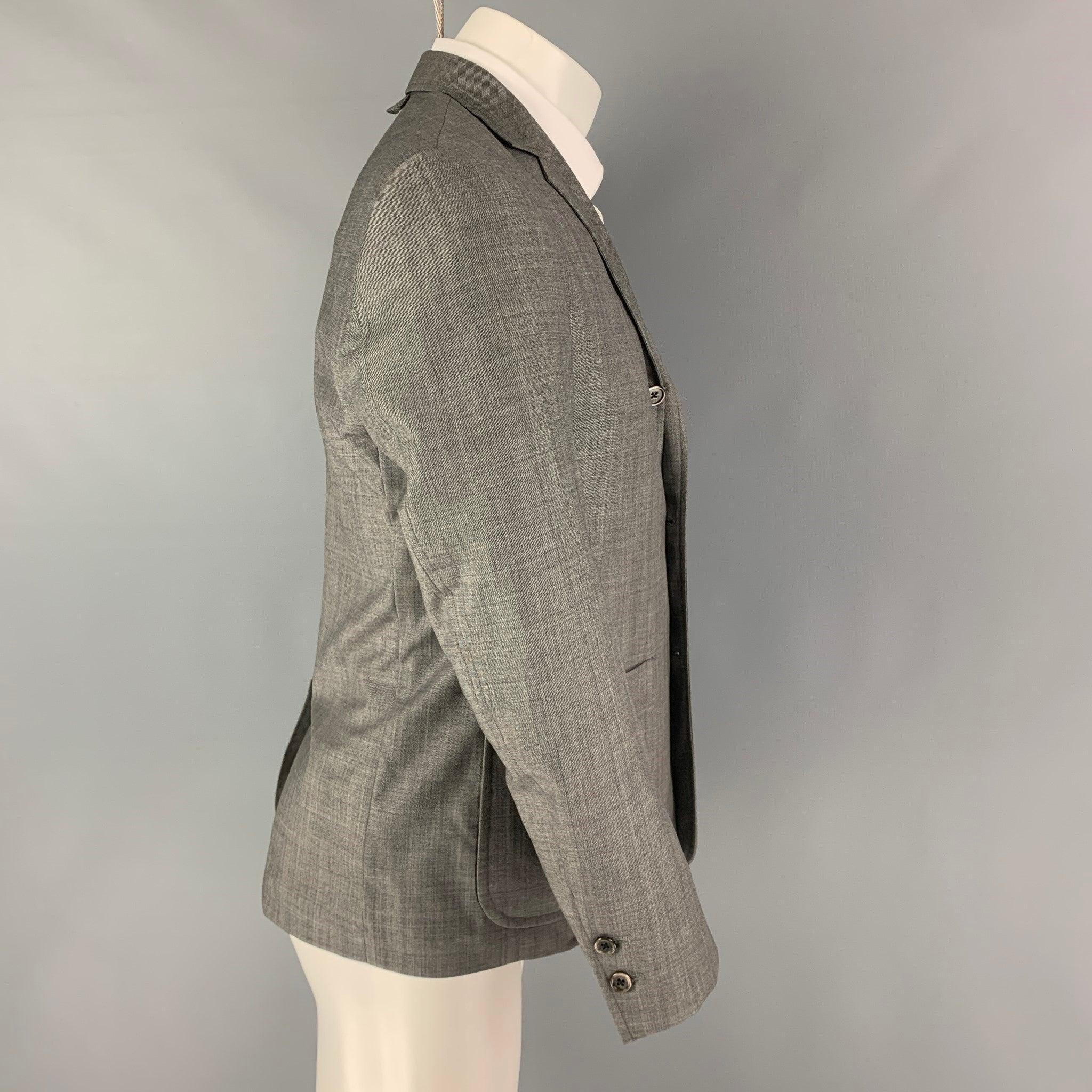 BLACK FLEECE sport coat comes in a grey featuring a notch lapel, patch pockets, single back vent, and a three button closure.
Very Good
Pre-Owned Condition.  

Marked:   BB1 

Measurements: 
  
Shoulder: 17 inches Chest:
38 inches Sleeve:
24 inches