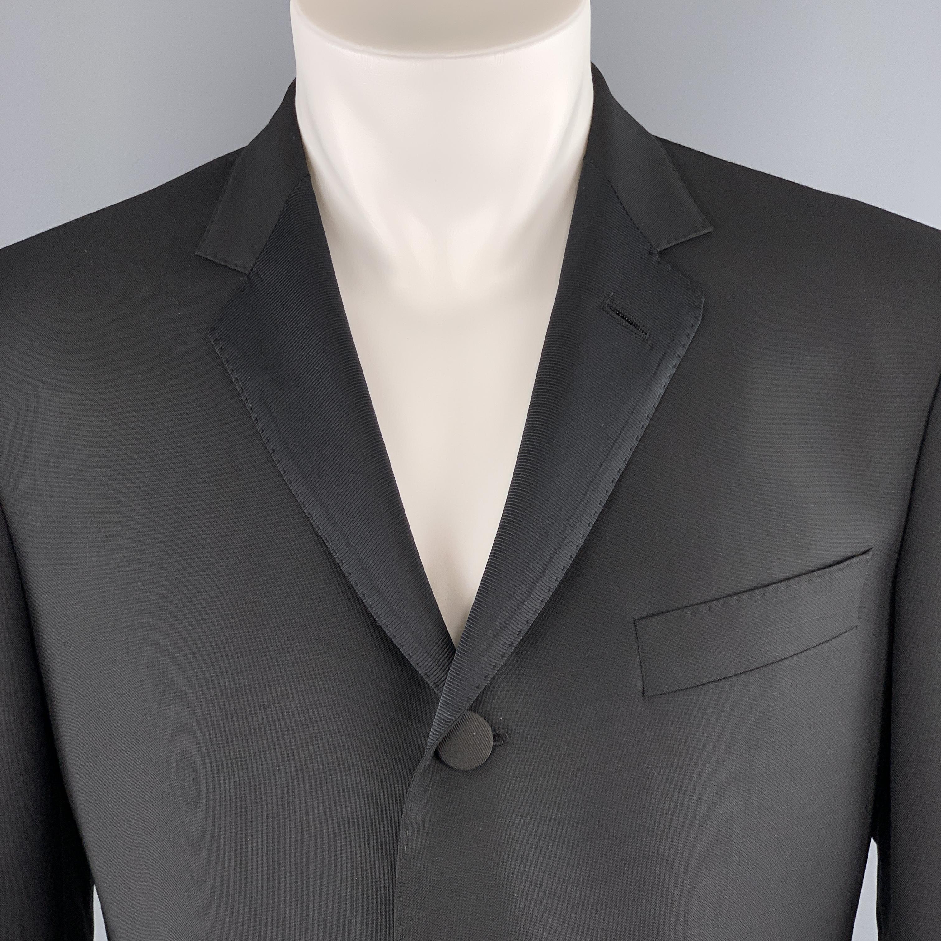 BLACK FLEECE by THOM BROWN sport coat comes in black wool with a faille notch lapel, single breasted, three button front, and double vent back. Made in USA.

Excellent Pre-Owned Condition.
Marked: BB3

Measurements:

Shoulder: 18 in.
Chest: 43