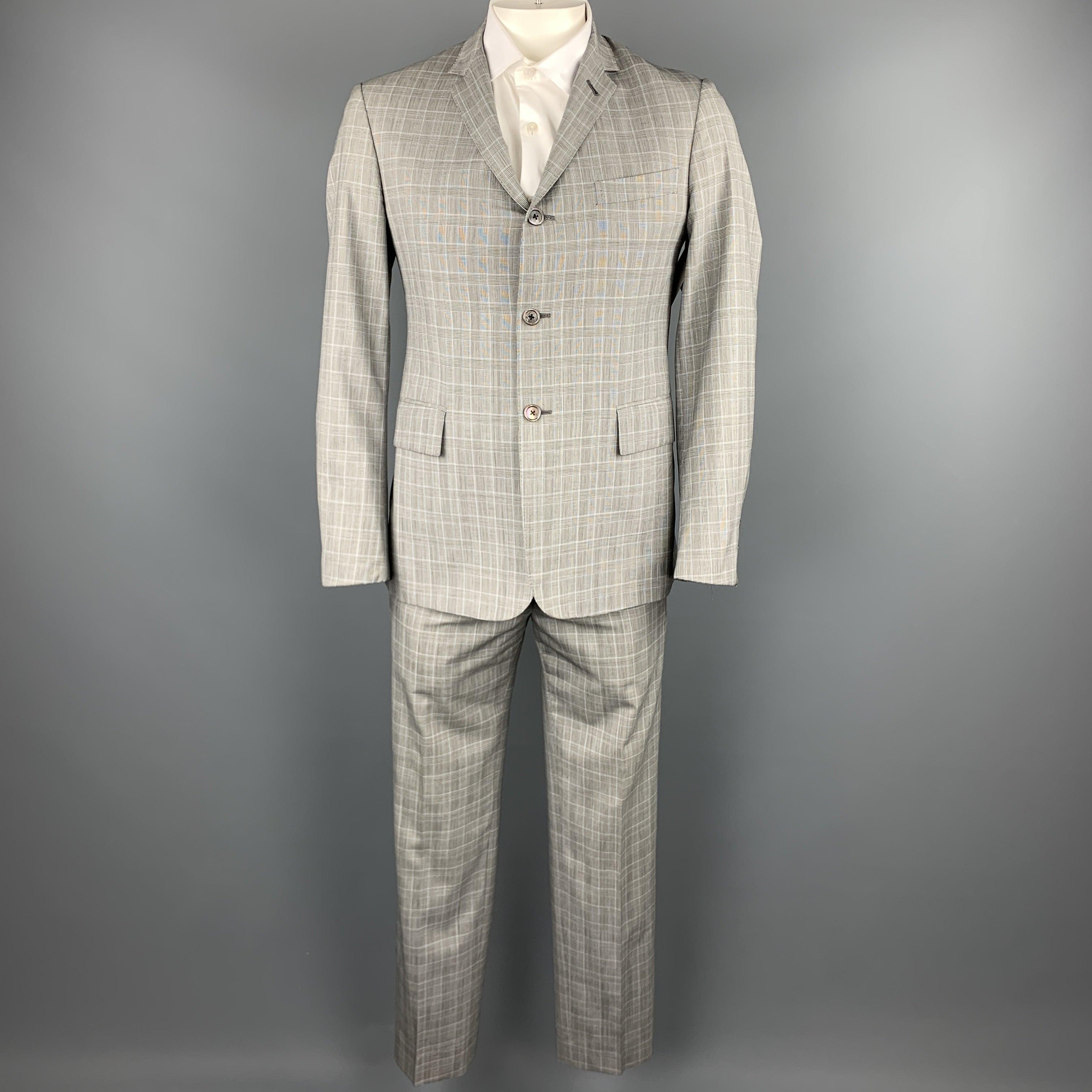 BLACK FLEECE
suit comes in a gray glenplaid wool and includes a single breasted, three button sport coat with a notch lapel and matching flat front trousers. Made in Italy.
Excellent Pre-Owned Condition. 

Marked:   BB 2 

Measurements: 
 