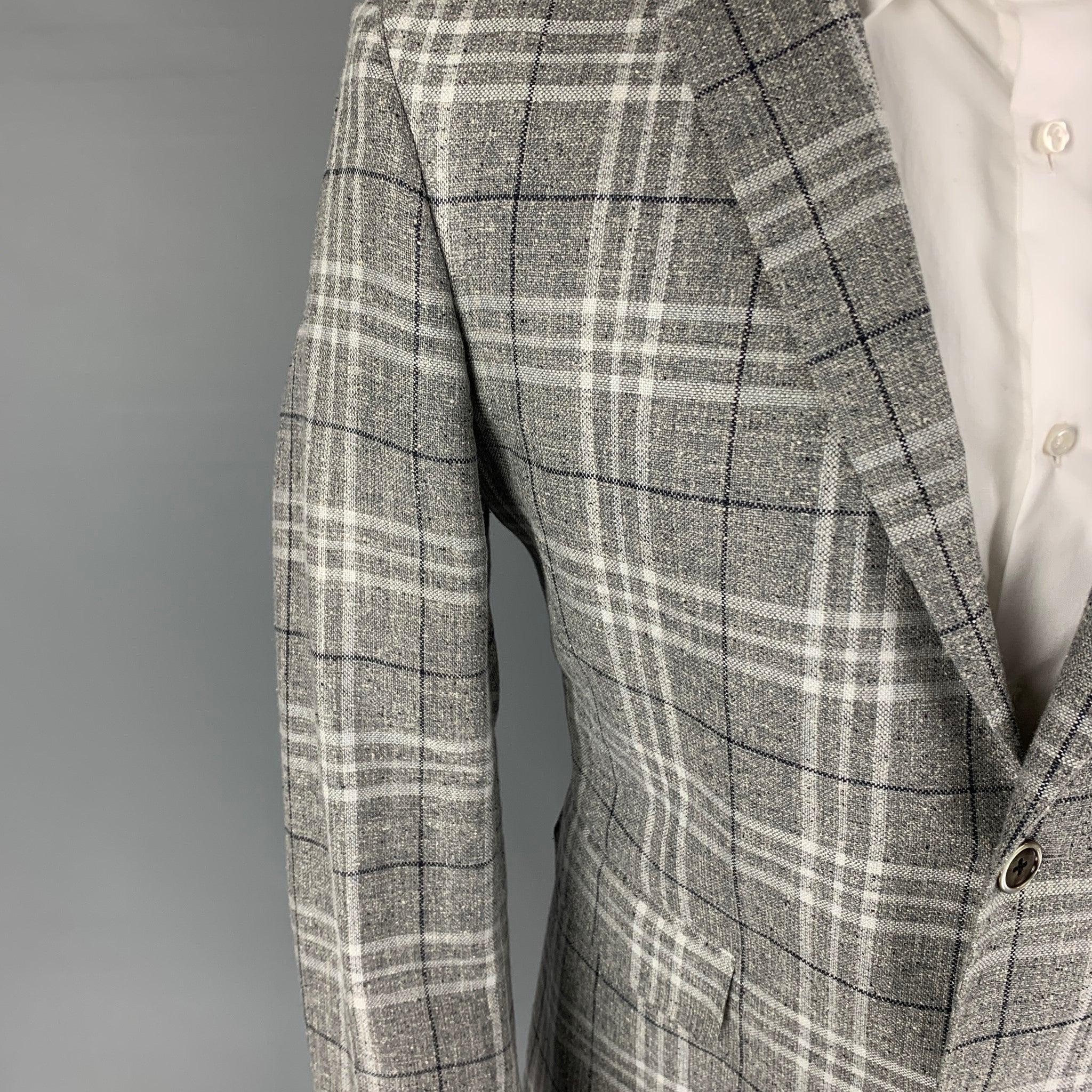 BLACK FLEECE sport coat comes in a light grey plaid silk blend with a full liner featuring a notch lapel, flap pockets, double back vent, and a double button closure. Made in USA.
Excellent
Pre-Owned Condition. 

Marked:   BB2  

Measurements: 
