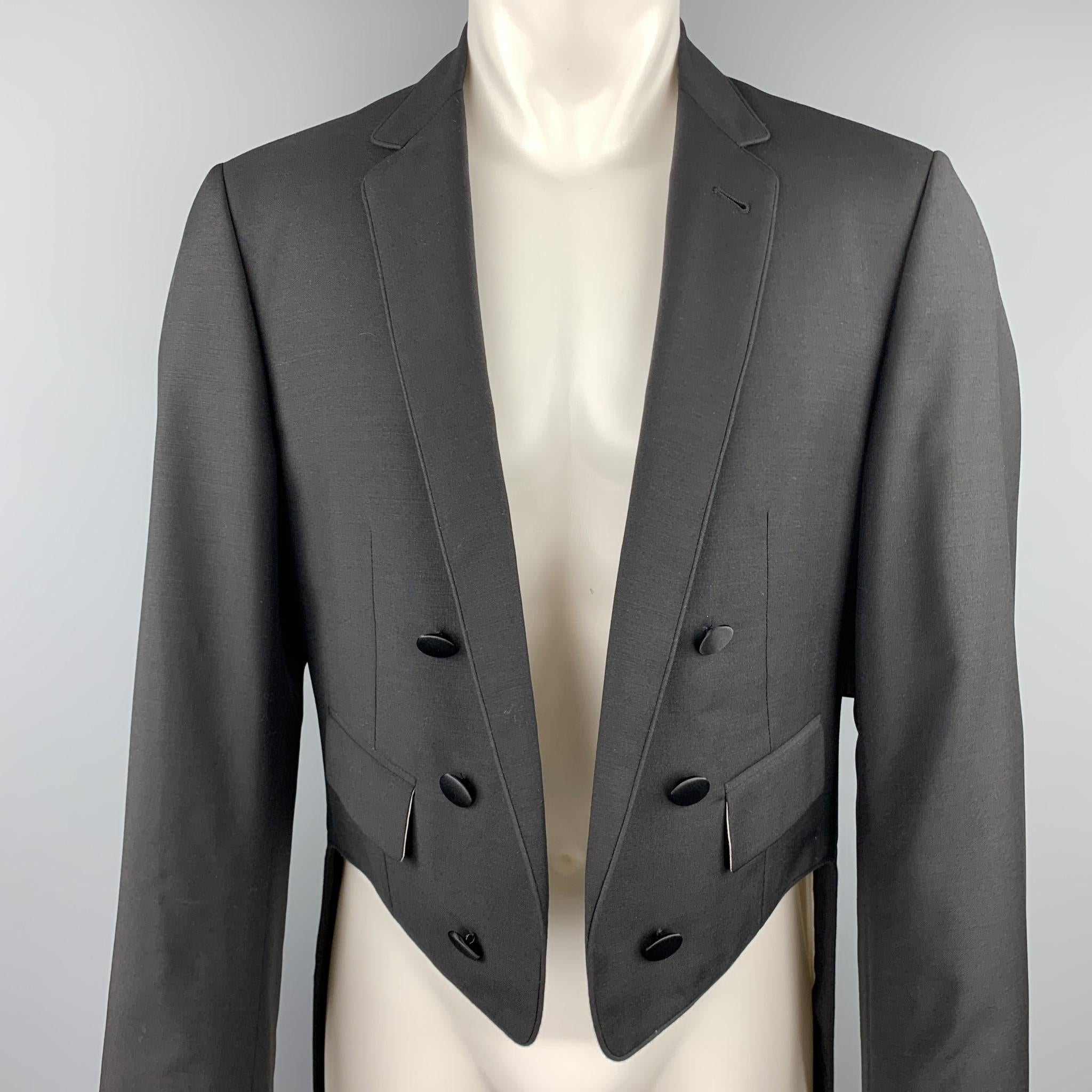 BLACK FLEECE jacket comes in black wool with a notch lapel open cropped front, satin piping, and coat tails back. Made in Italy.

New with Tags. 
Marked: BB 3

Measurements:

Shoulder: 18 in.
Chest: 44 in.
Sleeve: 25.5 in.
Length: 22-43 in.