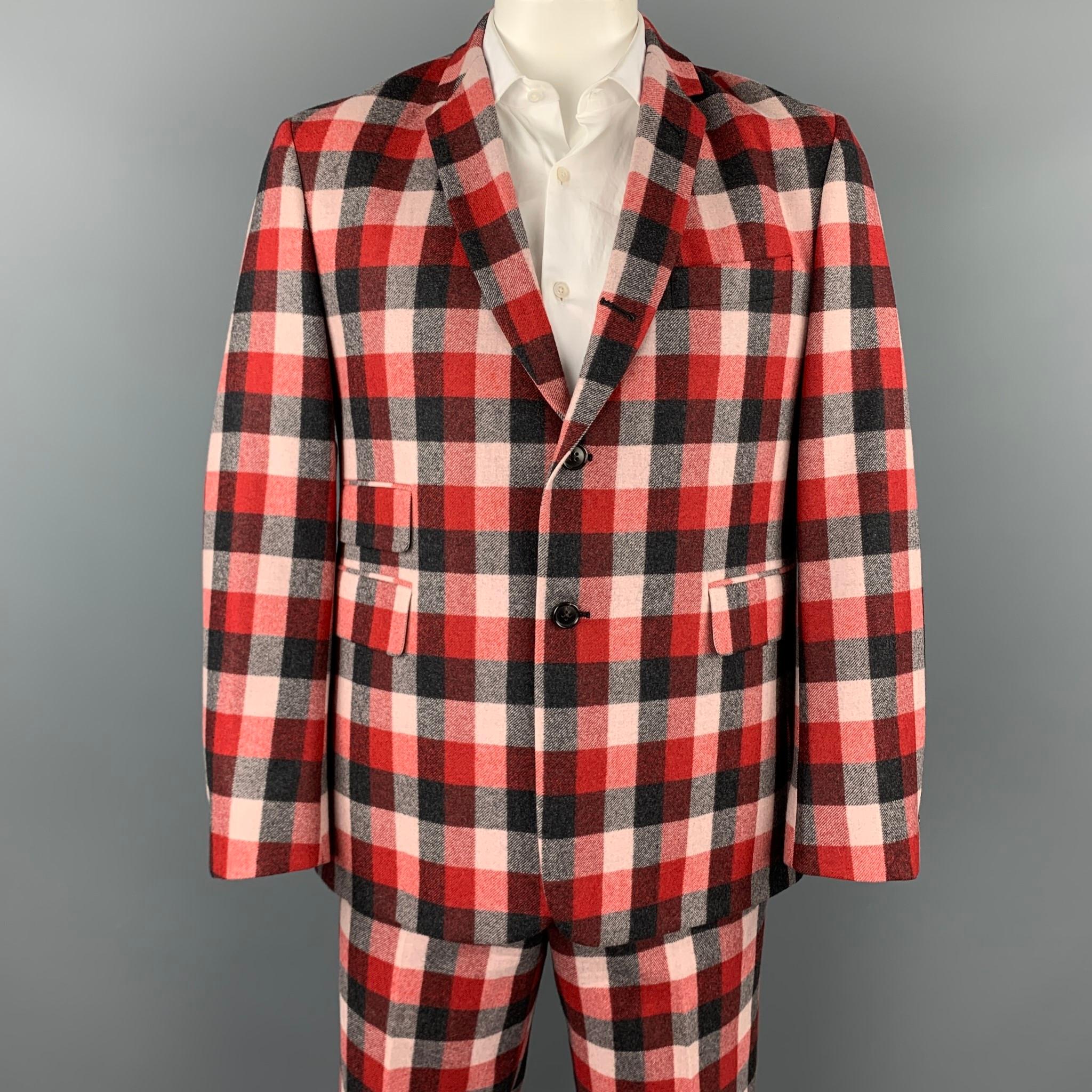 BLACK FLEECE shorts suit comes in a black & red plaid wool with a full liner and includes a single breasted,  three button sport coat with a notch lapel and matching shorts.

Very Good Pre-Owned Condition.
Marked: