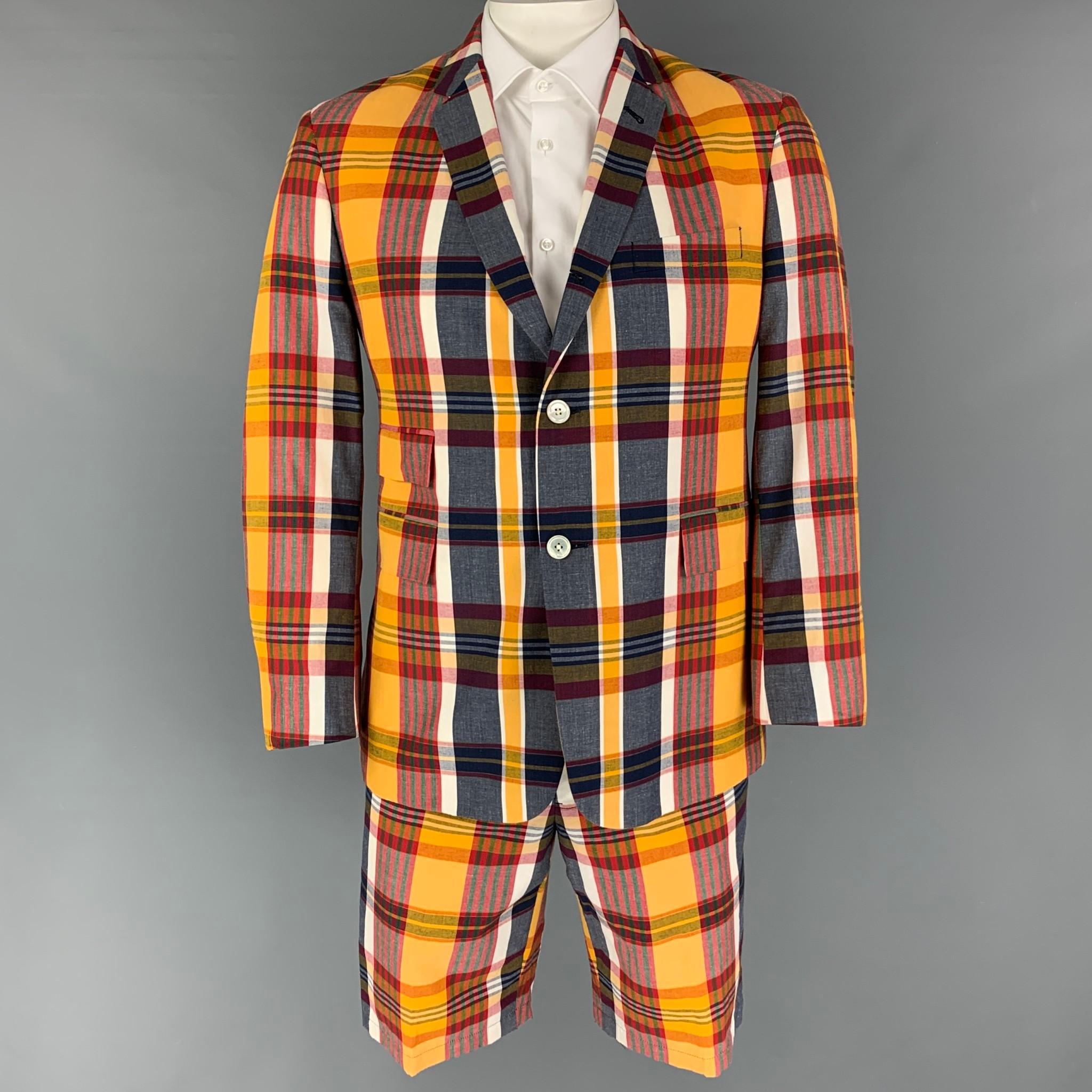 BLACK FLEECE suit comes in a yellow & multi-color plaid cotton with a half liner and includes a single breasted,  double button sport coat with a notch lapel and matching flat front shorts.

Very Good Pre-Owned Condition.
Marked: