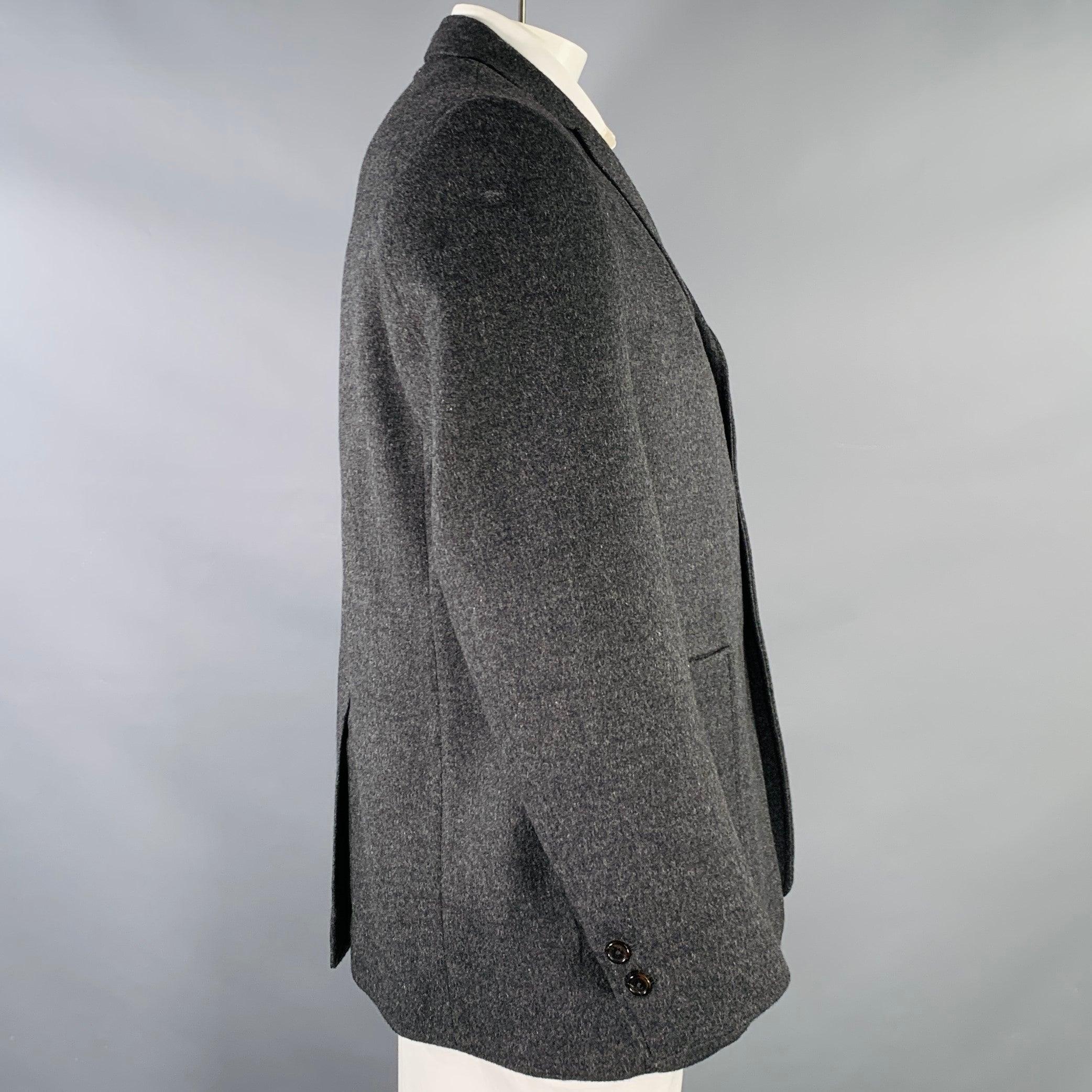 BLACK FLEECE sport coat in a charcoal grey camel hair featuring a notch lapel, single vented back, and three button closure. Made in USA.Excellent Pre-Owned Condition. 

Marked:   BB5 

Measurements: 
 
Shoulder: 17.5 inches Chest: 46 inches Sleeve: