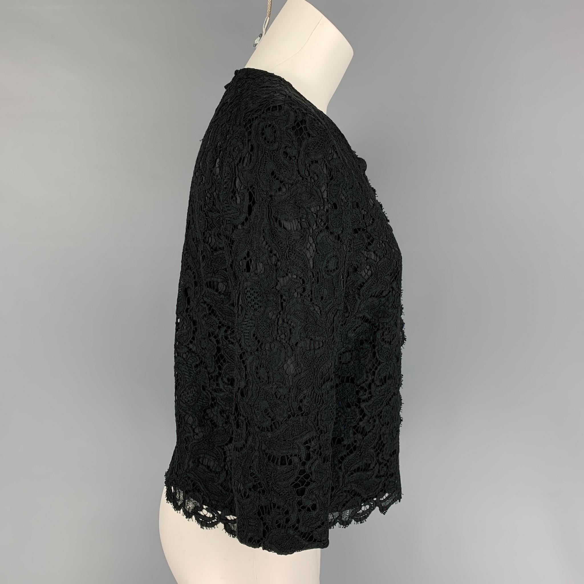 BLACK FLEECE jacket comes in a black lace cotton blend featuring a cropped style and a buttoned closure. 

Very Good Pre-Owned Condition.
Marked: BB2

Measurements:

Shoulder: 15 in.
Bust: 34 in.
Sleeve: 16.5 in.
Length: 20 in. 