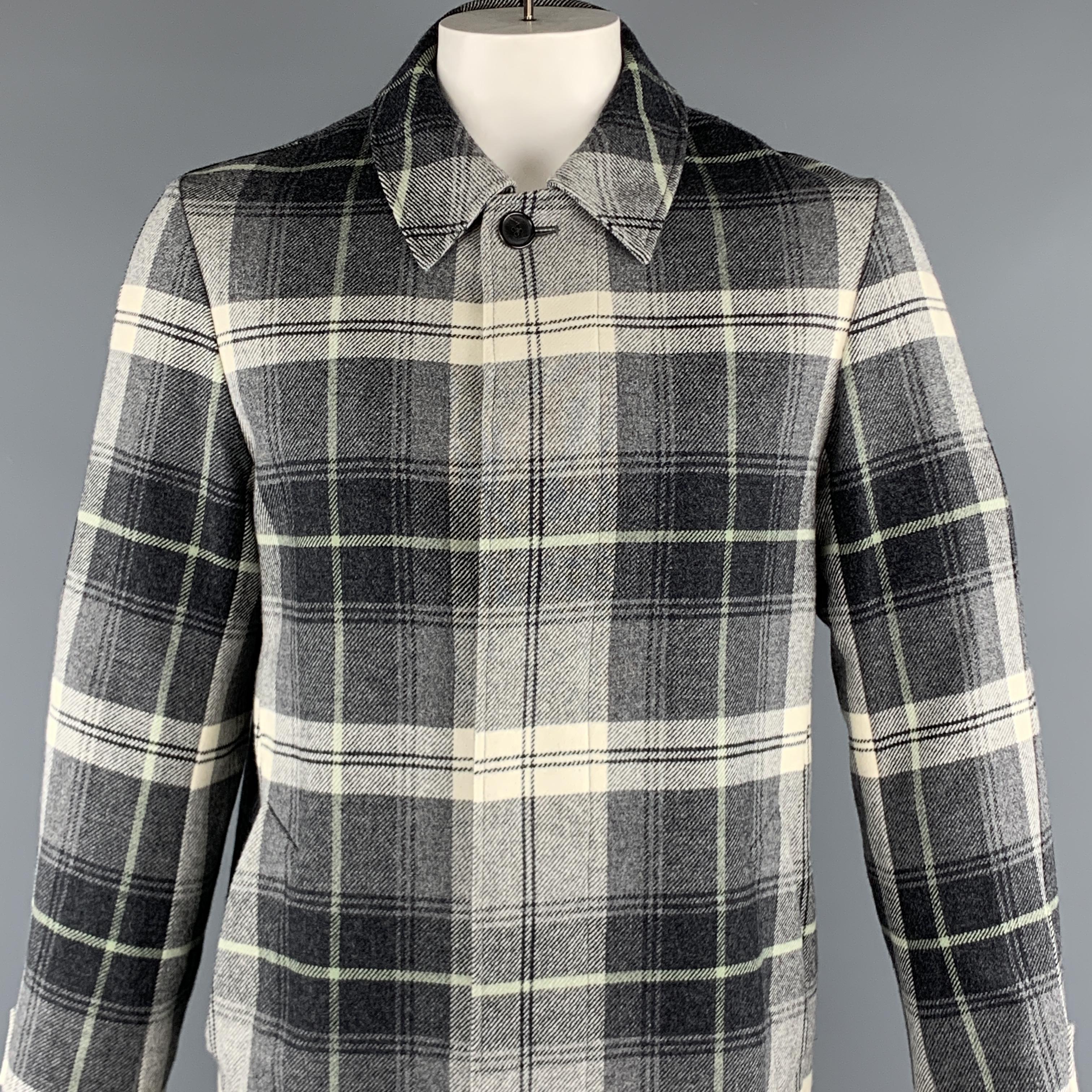 BLACK FLEECE Coat comes in a gray and white plaid wool featuring a hidden button closure, slit pockets, and a spread collar. 

Excellent Pre-Owned Condition.
Marked: BB3

Measurements:

Shoulder: 19 in. 
Chest: 42 in. 
Sleeve: 26 in. 
Length: 39 in. 