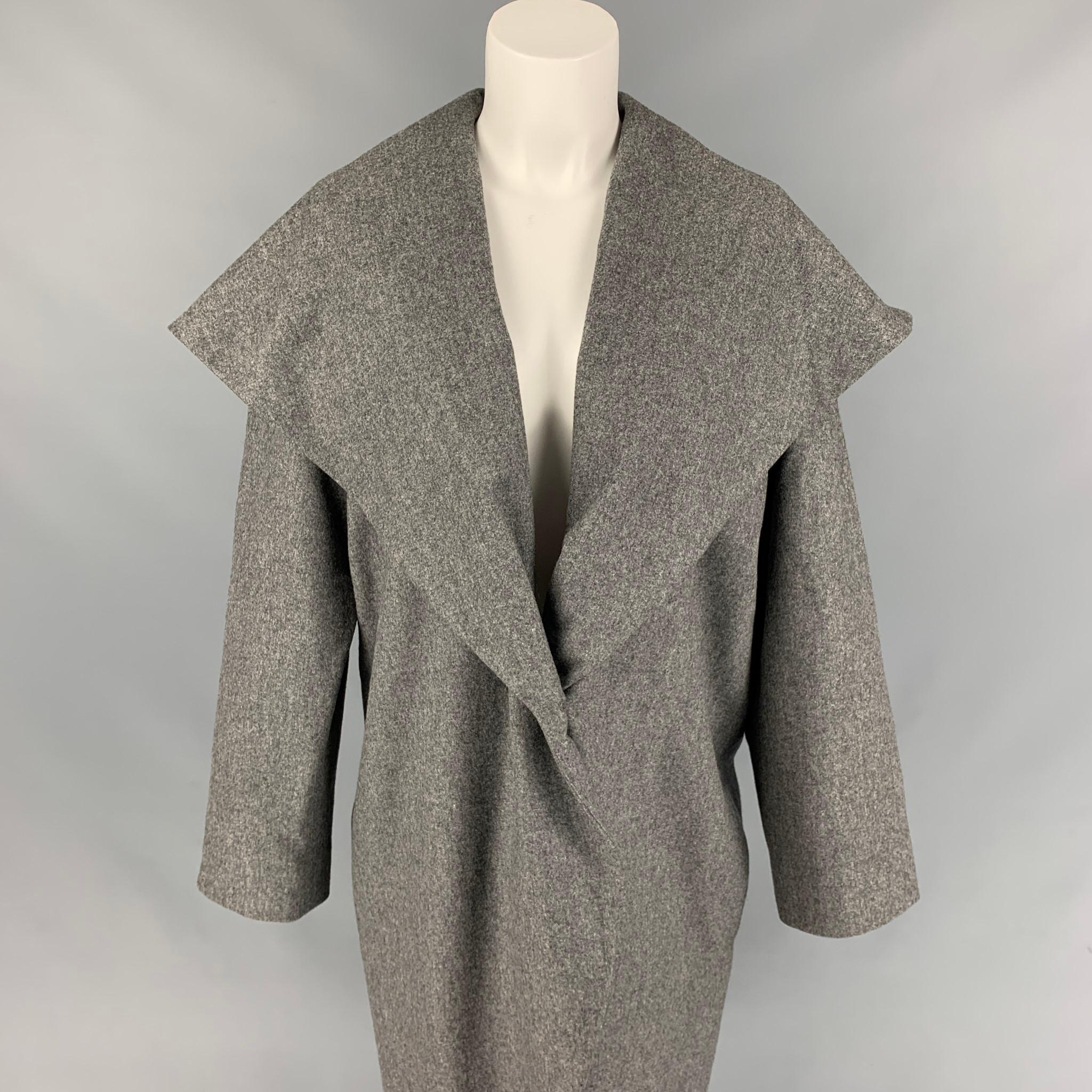 BLACK FLEECE coat comes in a grey heather material featuring a large shawl collar, slit pockets, and a buttoned closure. 

Very Good Pre-Owned Condition.
Marked: BB2

Measurements:

Shoulder: 15 in.
Bust: 44 in.
Sleeve: 24 in.
Length: 41 in. 
