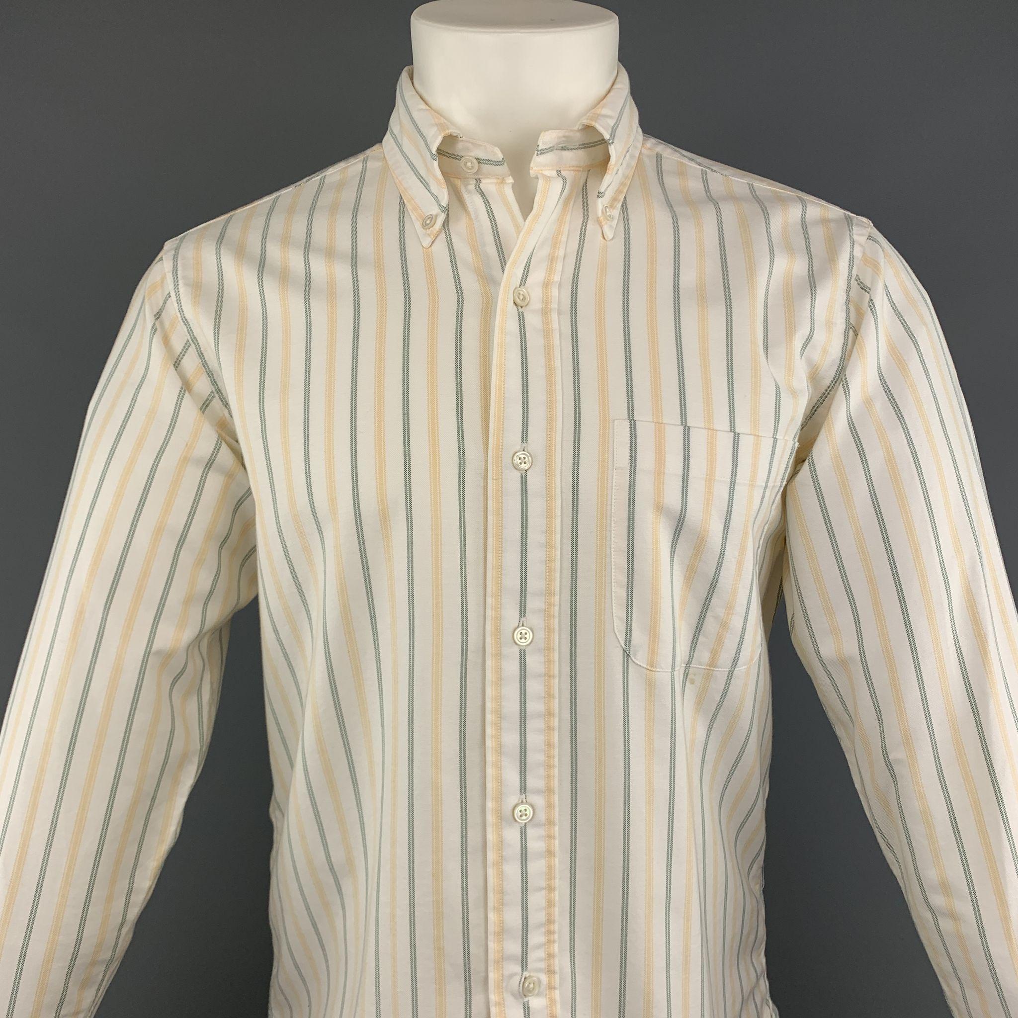 BLACK FLEECE long sleeve shirt comes in a white cotton with green and yellow striped featuring a button down style and a front patch pocket. Minor stains in front. As-Is. Made in USA.
 
Good Pre-Owned Condition.
Marked: BB1
 
Measurements:
