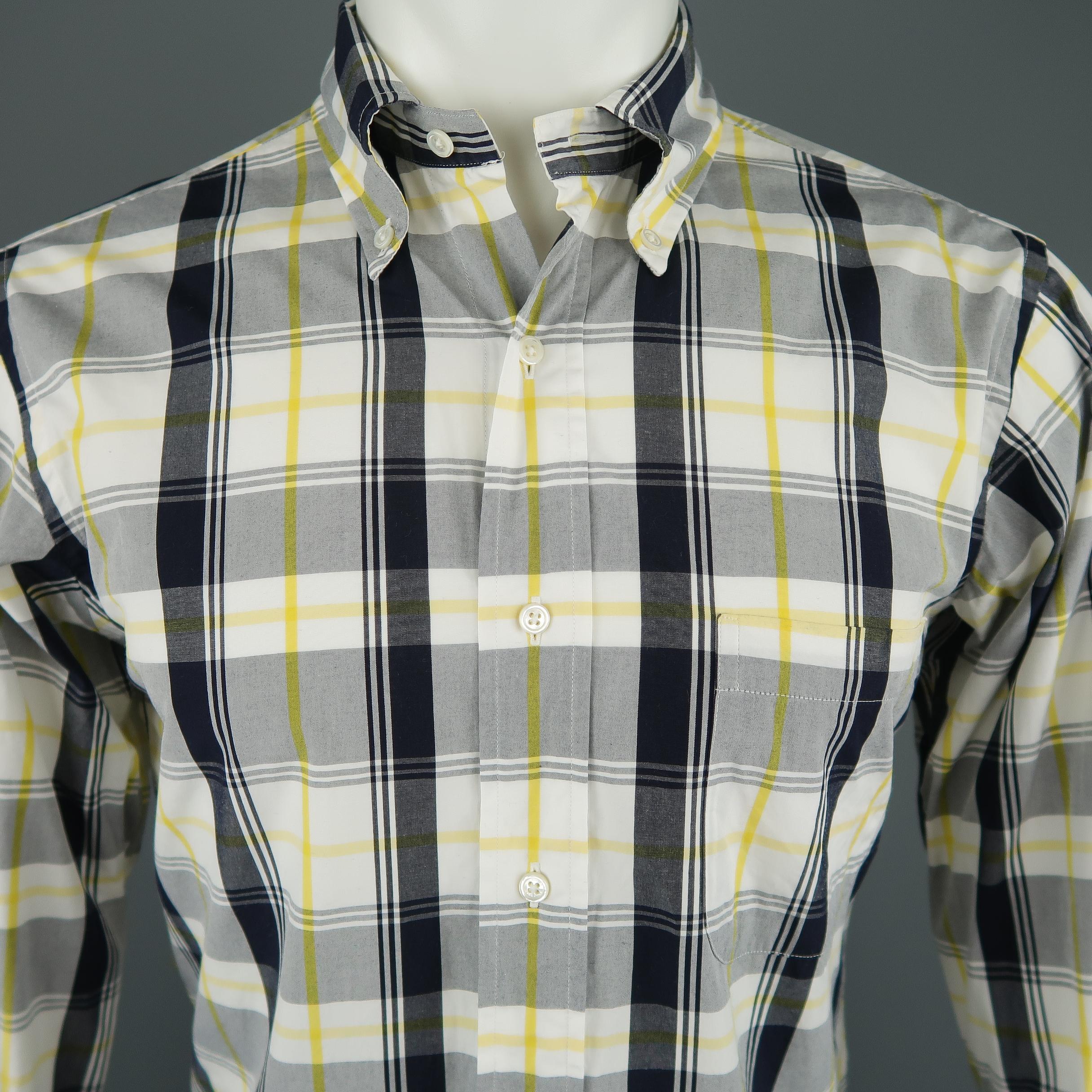 BLACK FLEECE shirt comes in off white cotton with navy and yellow plaid pattern throughout, button down collar, curved hem, and patch pocket. Made in USA. Retail price $225,00. 
 
Excellent Pre-Owned Condition.
Marked: BB1
 
Measurements:
