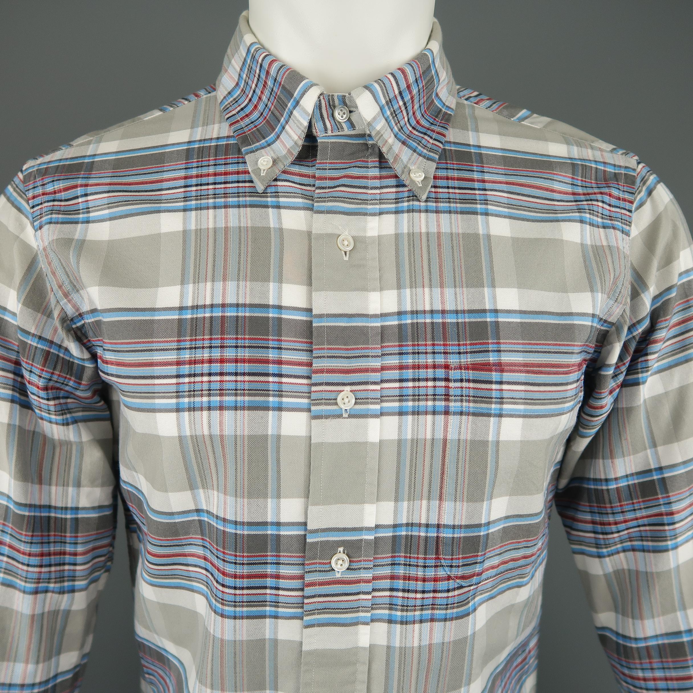 BLACK FLEECE shirt comes in white cotton with gray, red, and blue plaid pattern throughout, button down collar, curved hem, and patch pocket. Made in USA. Retail price $225,00. 
 
Excellent Pre-Owned Condition.
Marked: BB0
 
Measurements:
