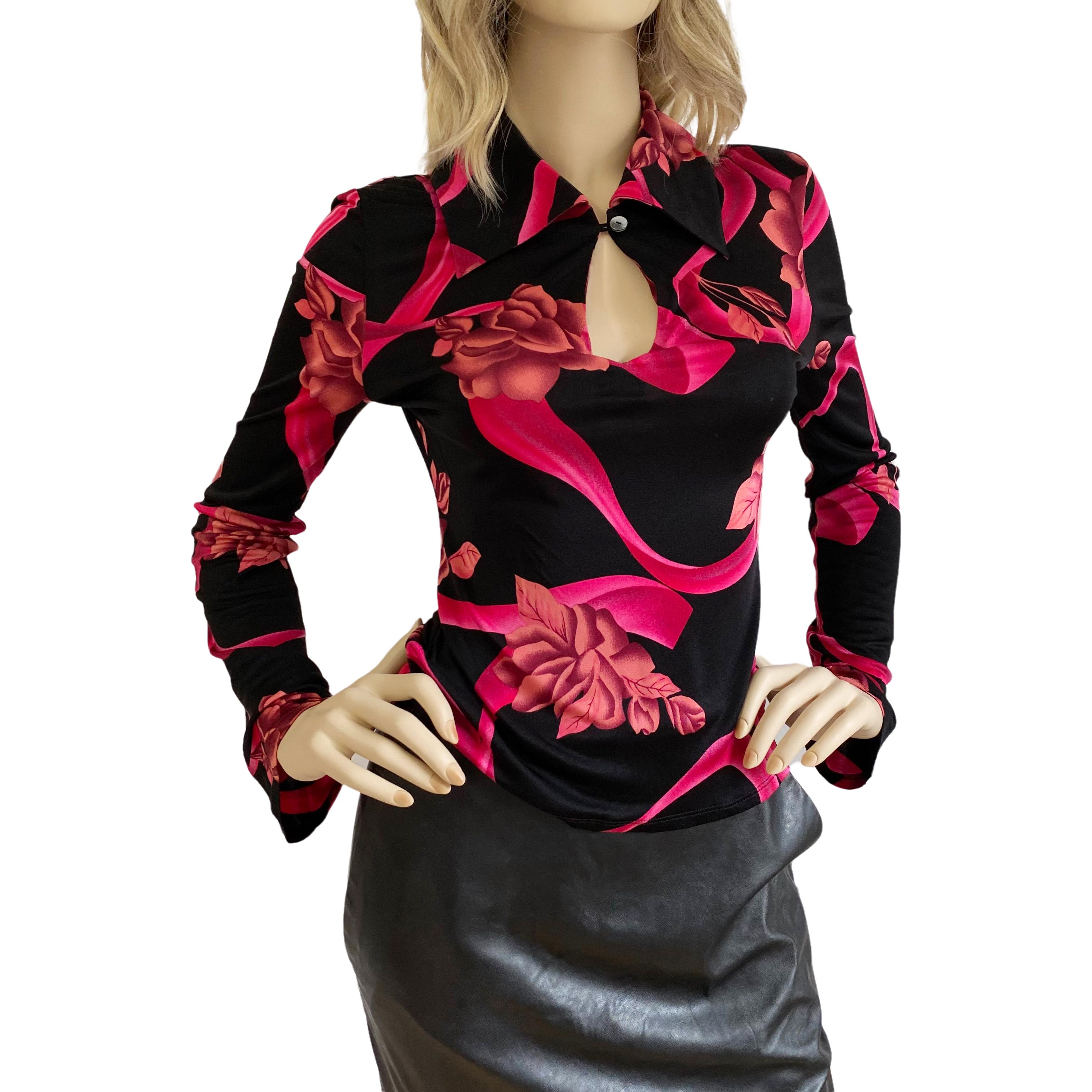 Cool silk shirt with loop + single abalone button  - creates a peekaboo effect when buttoned.
Slightly bell sleeves.
Hand-designed, floral print on black ground.
Approximately 23