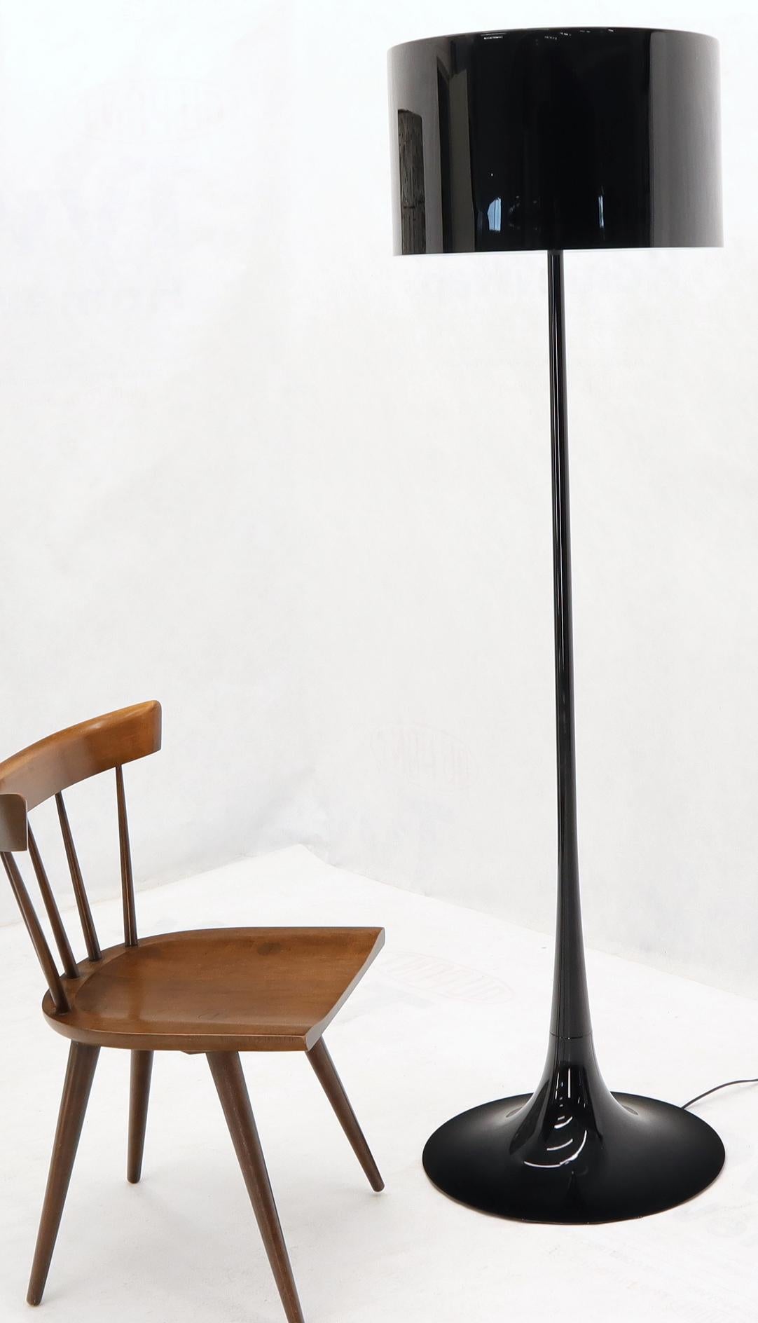 Designed by Sebastian Wrong in 2003, the Spun Light-F floor lamp reflects the best of modern manufacturing technology combined with elegance, craftsmanship, and dynamic fluid aesthetics. Its main body has a spun metal frame and diffuser. The