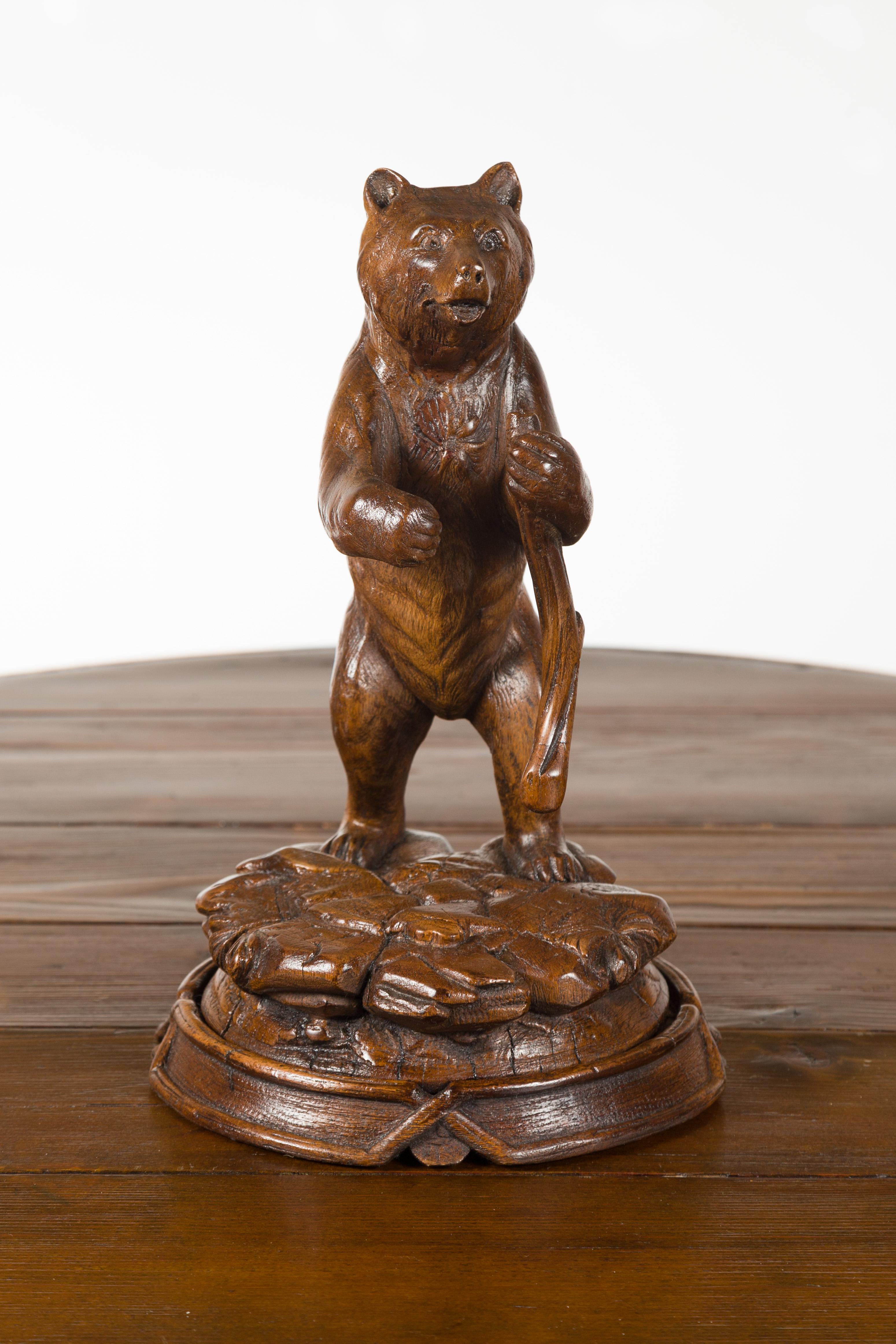 Swiss Black Forest 1890s Carved Wooden Bear Standing on a Circular Base For Sale