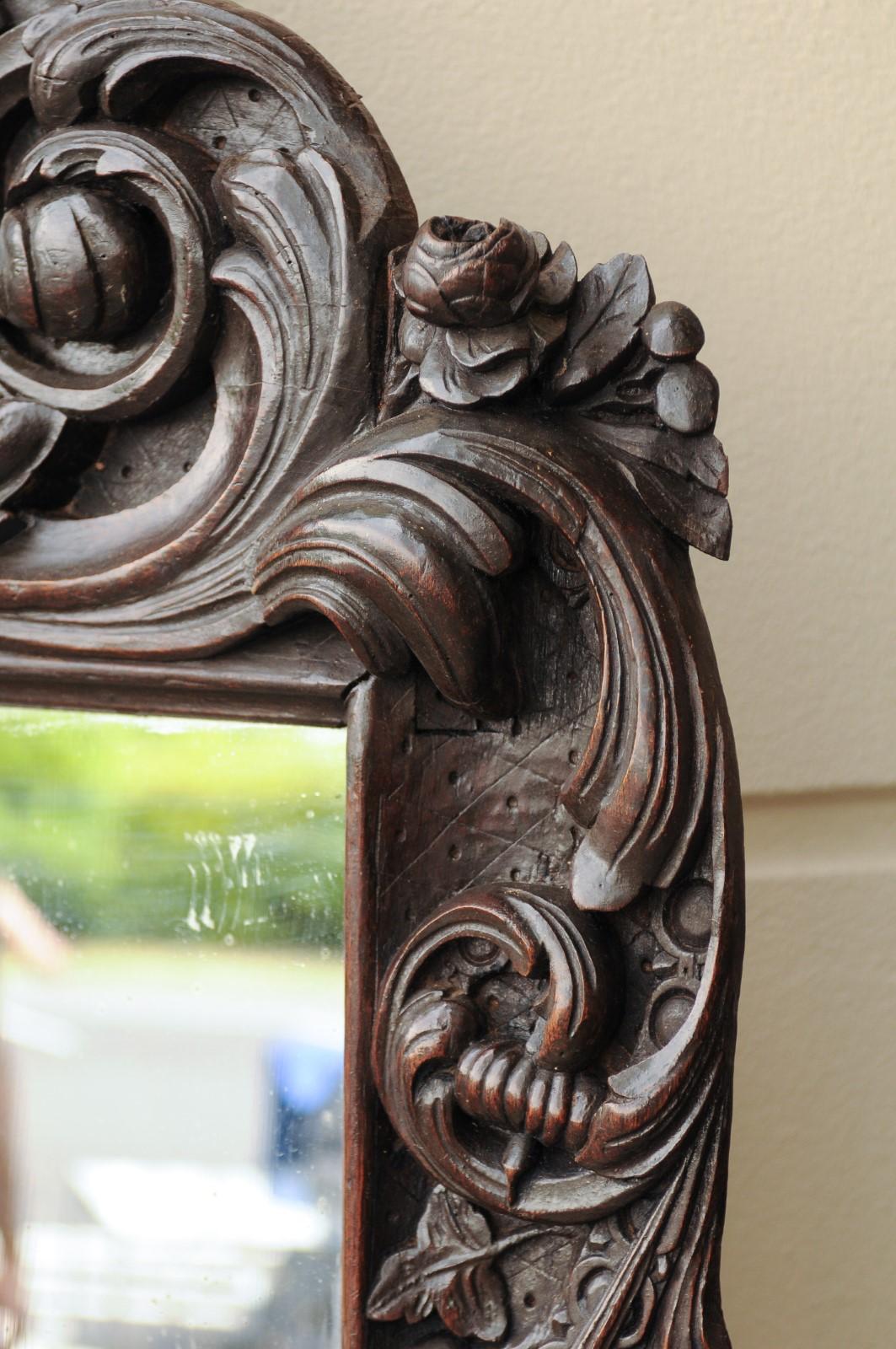 20th Century 1900s Hand Carved Wooden Mirror with Bouquet in Basket and Scrolls For Sale