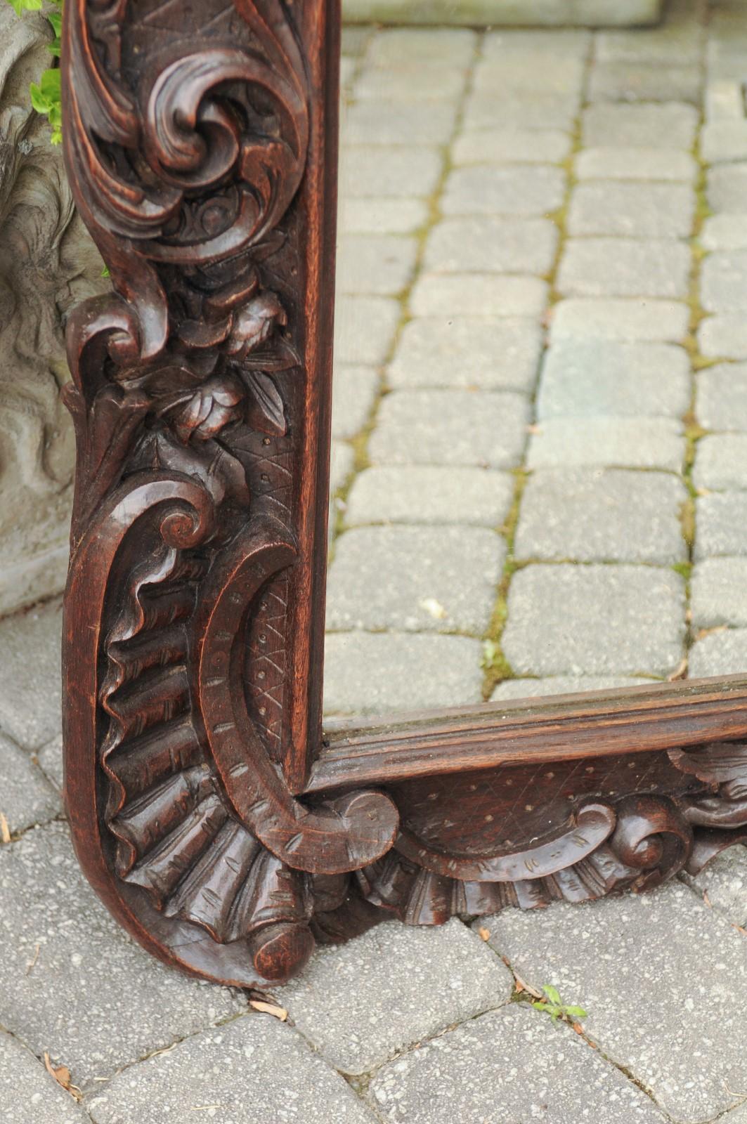 Swiss 1900s Hand Carved Wooden Mirror with Bouquet in Basket and Scrolls For Sale
