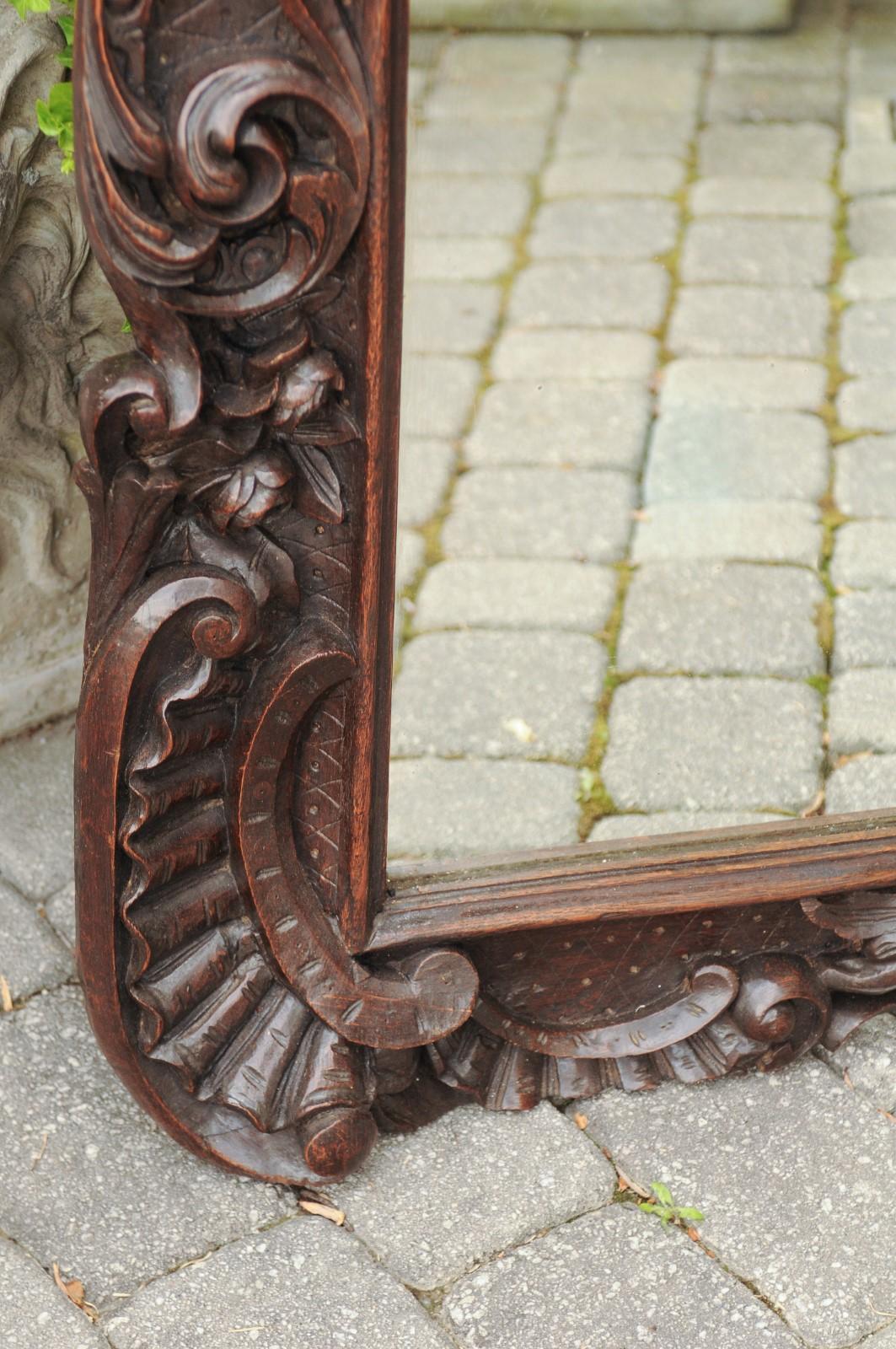 Hand-Carved Black Forest 1900s Hand Carved Wooden Mirror with Bouquet in Basket and Scrolls