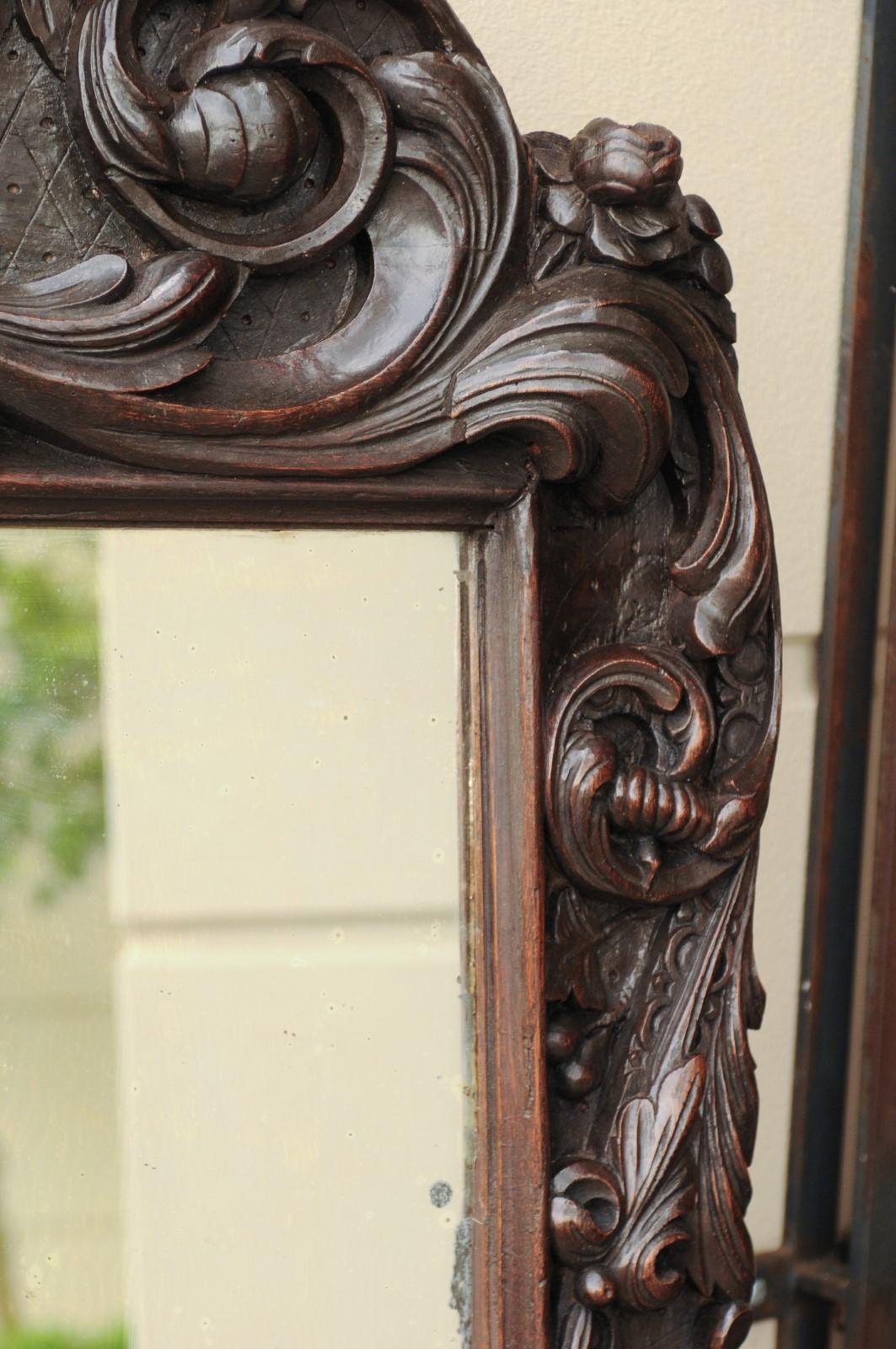 Hand-Carved 1900s Hand Carved Wooden Mirror with Bouquet in Basket and Scrolls For Sale