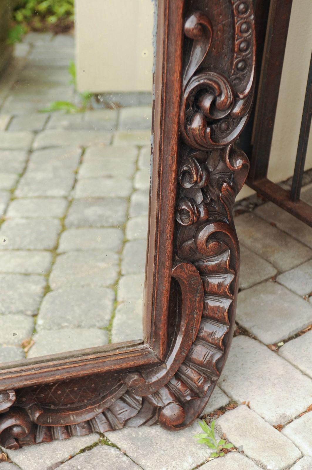 1900s Hand Carved Wooden Mirror with Bouquet in Basket and Scrolls In Good Condition For Sale In Atlanta, GA