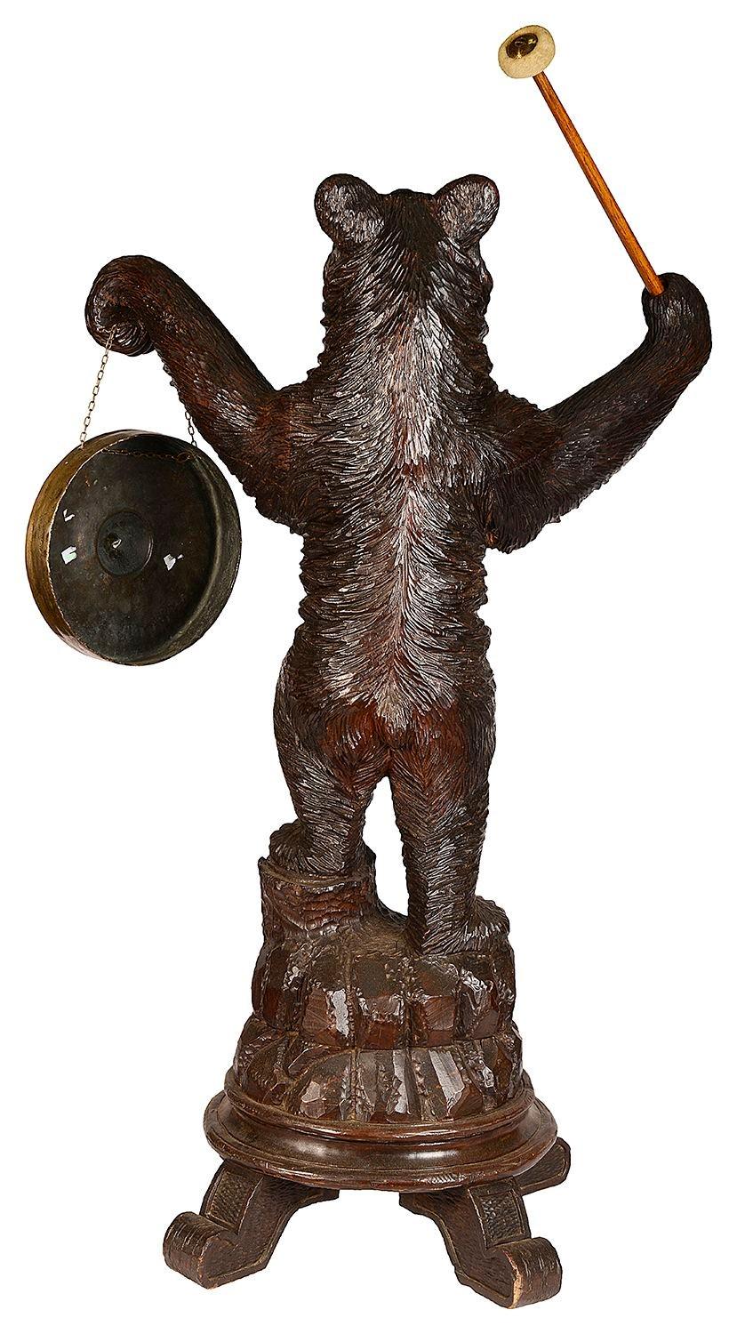 Softwood Black Forest Bear holding a Gong, 19th Century. For Sale