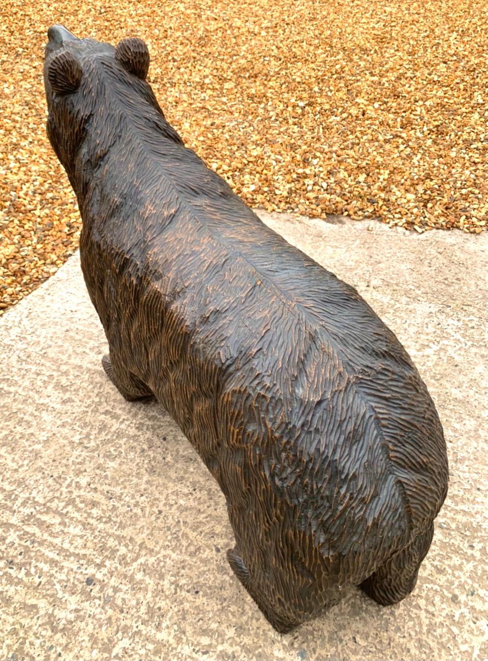 Heavily carved life size old Swiss bear on all fours.
Part of a private collection for more than 40 years.
Glass eyes.
Wheels inset within the bears feet for ease of moving around (see picture) one wheel missing.