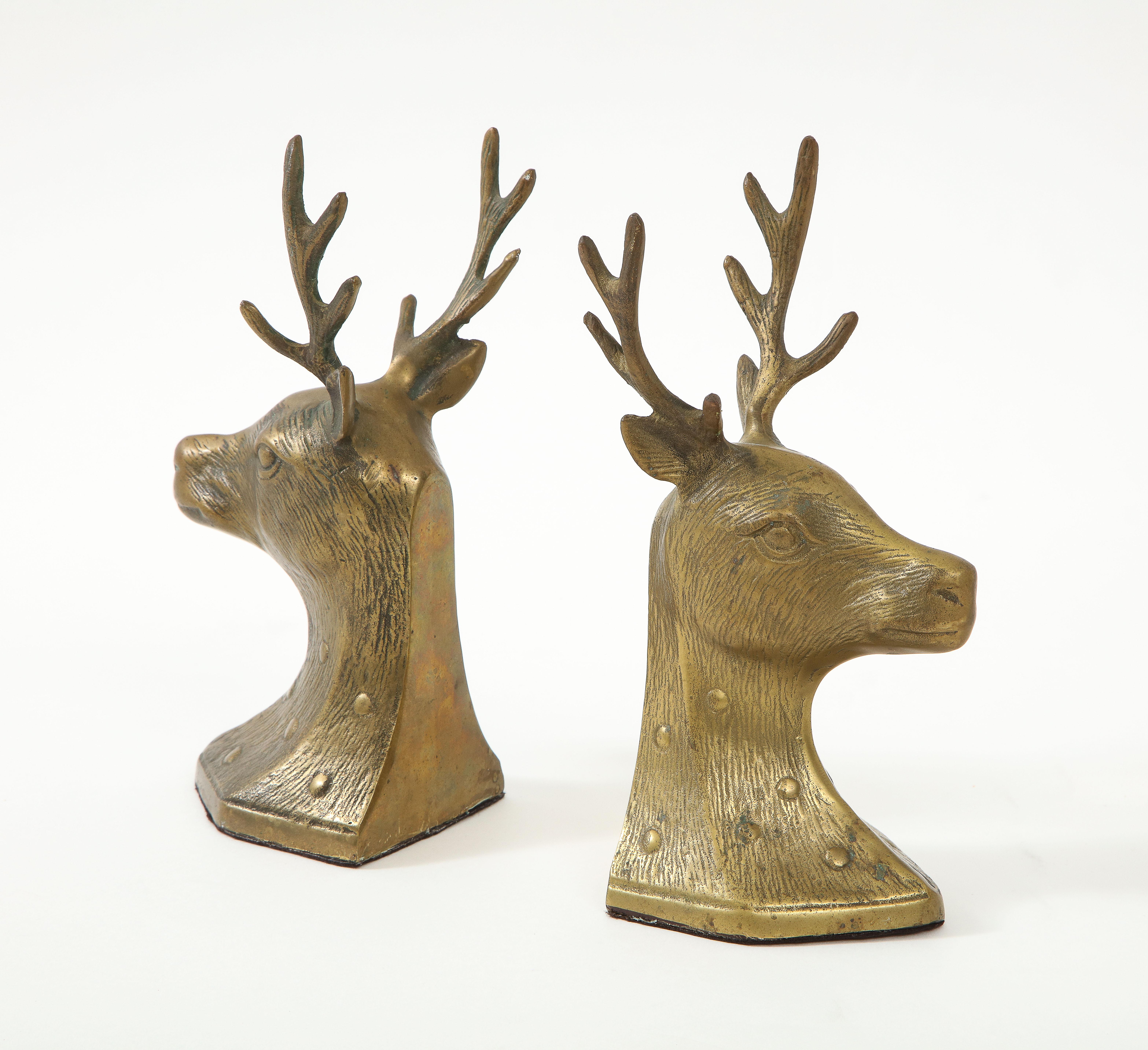 Set of cast Bronze stylized deer bookends with detailed antlers and coat.