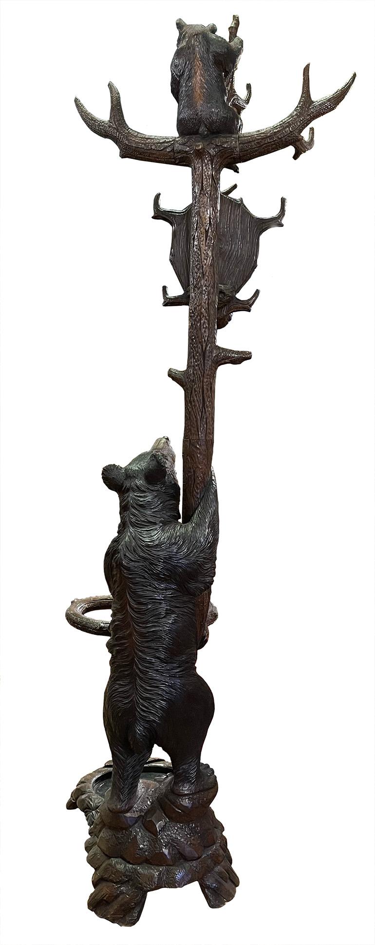 A Black Forest carved lindenwood hat/stick stand, circa 1900

Dimensions: 84