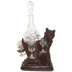 Antique Black Forest Carved Bear Liquor Tantalus Stand and Wine Decanter Set, circa 1895