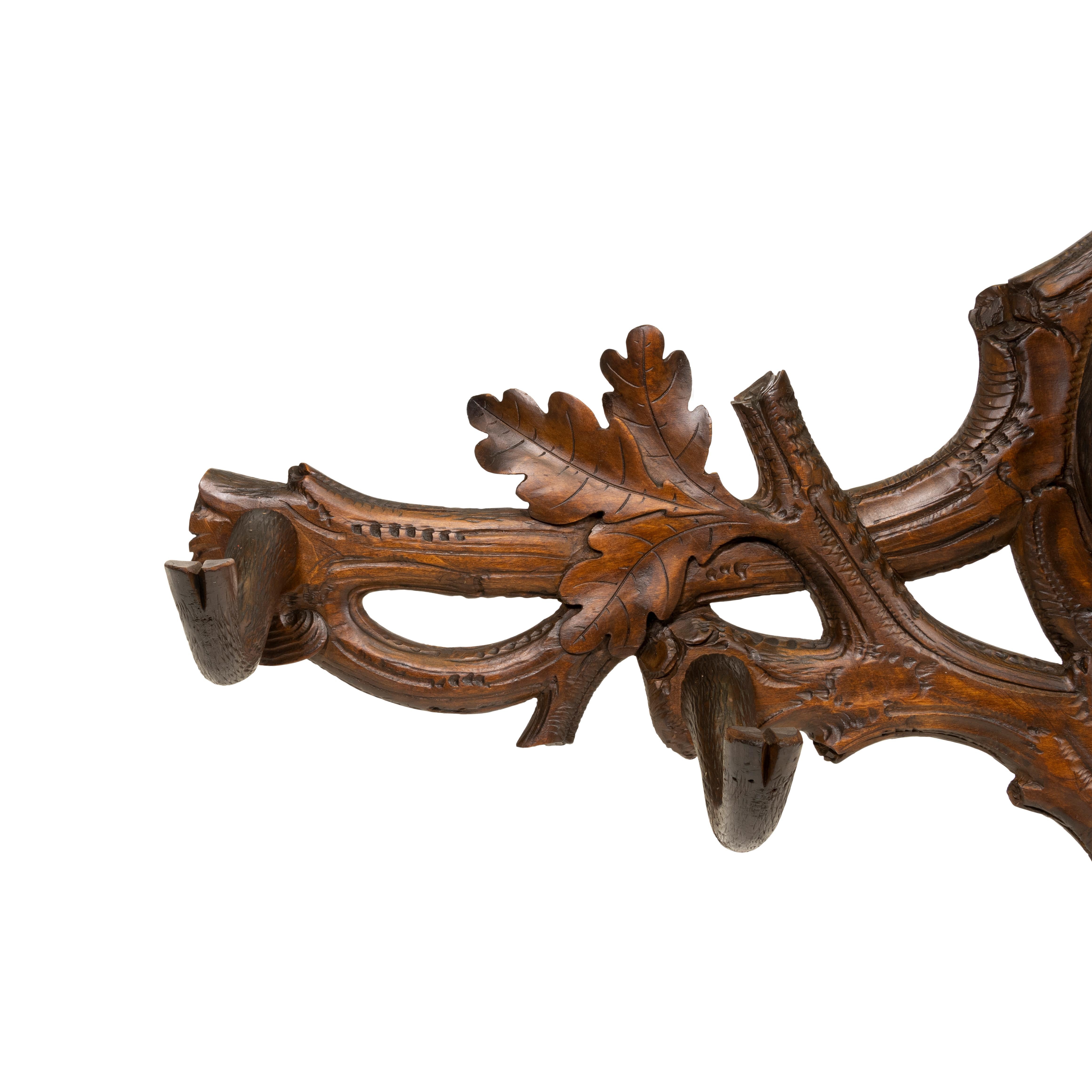Swiss Black Forest wall mount carved coat rack with chamois carving having real horns, glass eyes.
In the 1800’s the wood carving industry of Switzerland started in the town of Brienz. By the end of the 1800’s it had become the driving force for
