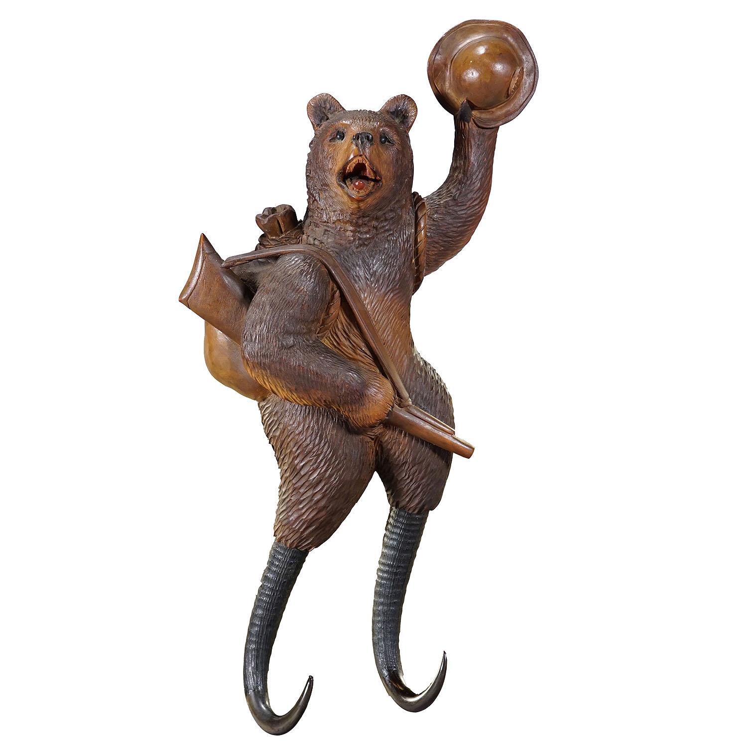 Black Forest Carved Coat Hook with Bear Poacher ca. 1900s

A very rare hand-carved coat hook or whip holder depicting a bear as a poacher with rifle, hat and rucksack. The hooks are made from real chamois horn. Hand-carved by Pierre Michel in