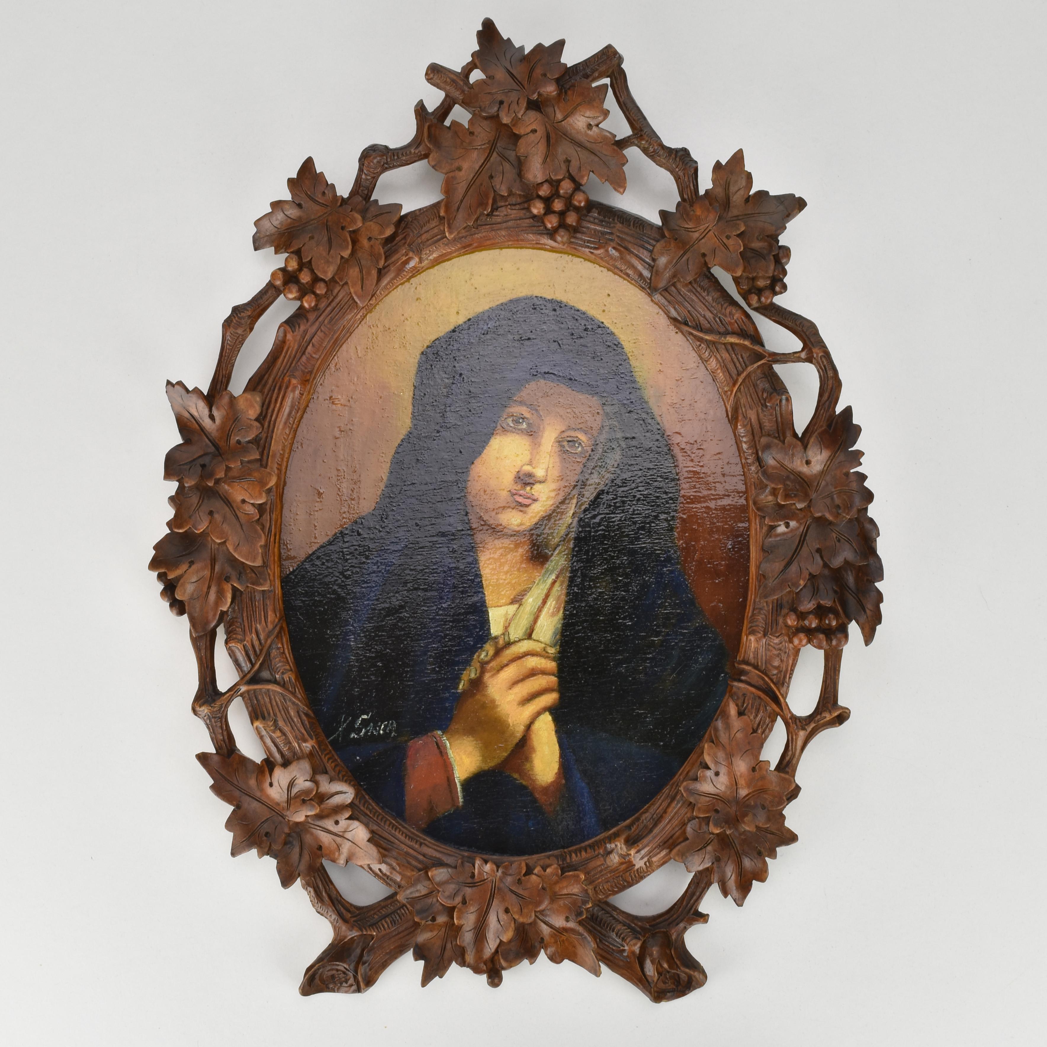A beautiful late 19th to early 20th century devotional painting on wood depicting the Holy Mother by the French artist Xavier Sager. The serene portrait, rendered in warm tones and soft shading, shows the Virgin Mary with hands clasped in prayer and