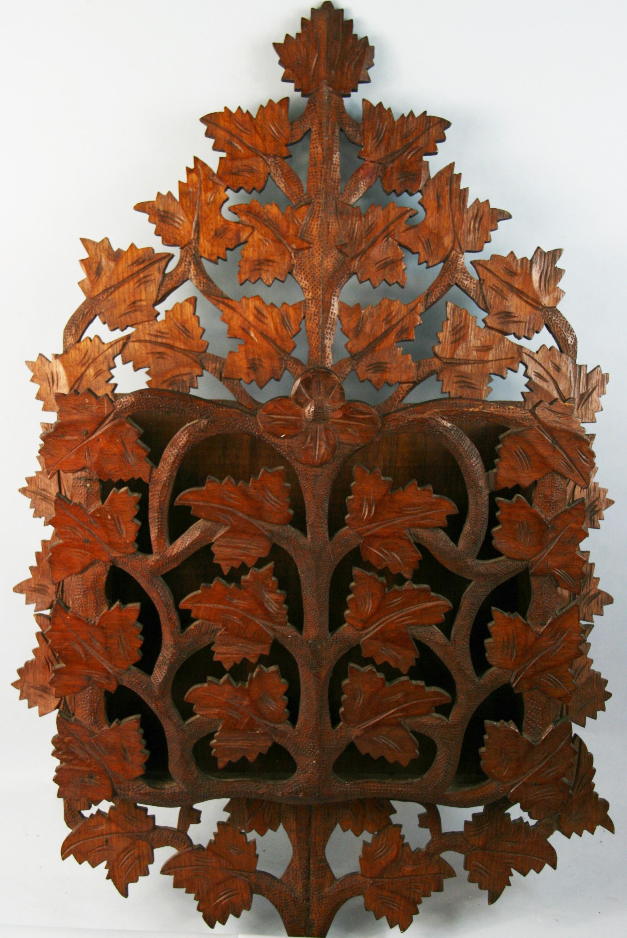 3-663 blackforest carved walnut leaf rack.