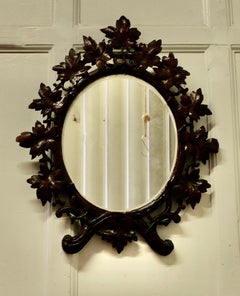 Black Forest Carved Oval Mirror