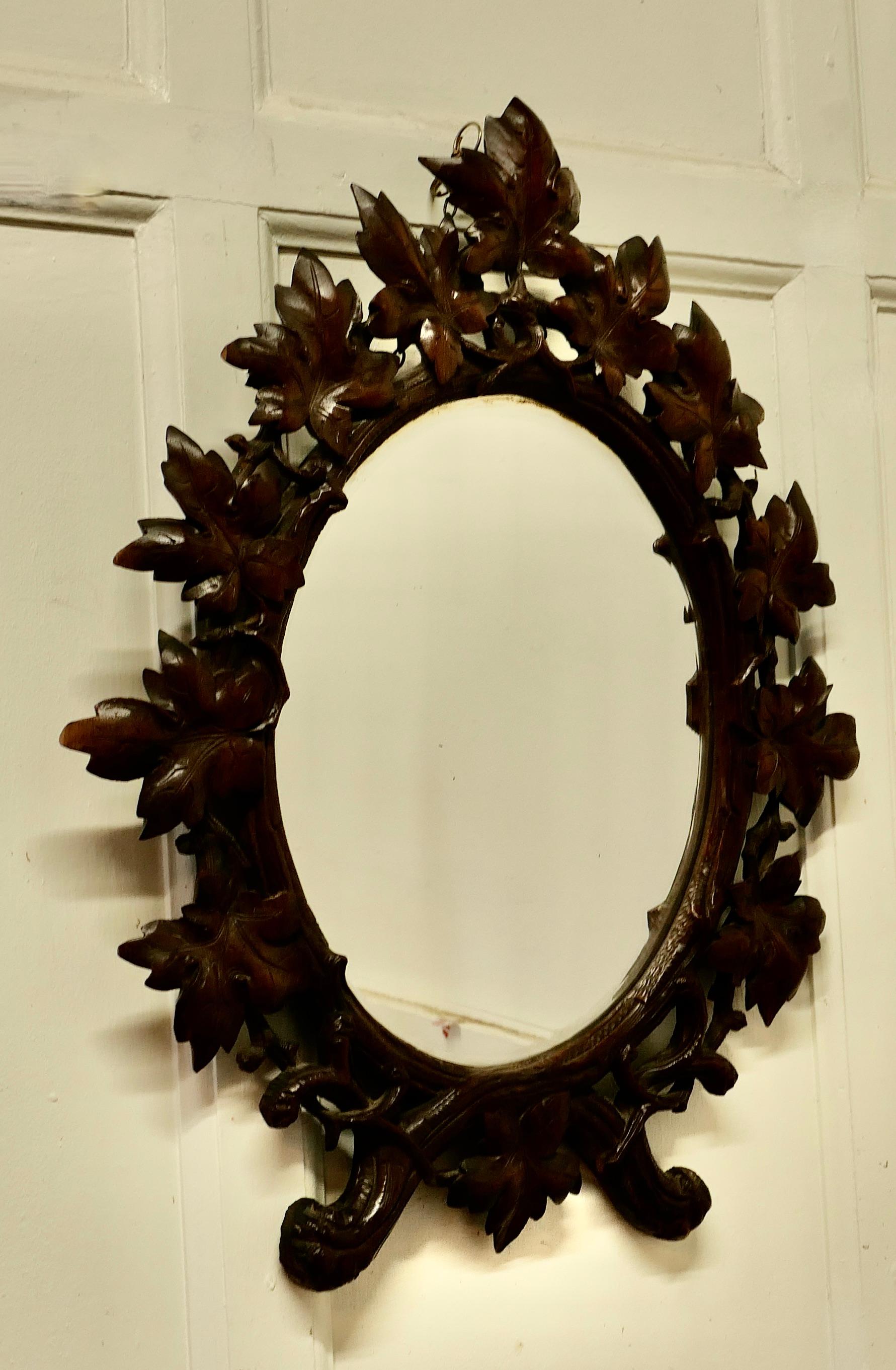 19th Century Black Forest Carved Oval Mirror For Sale