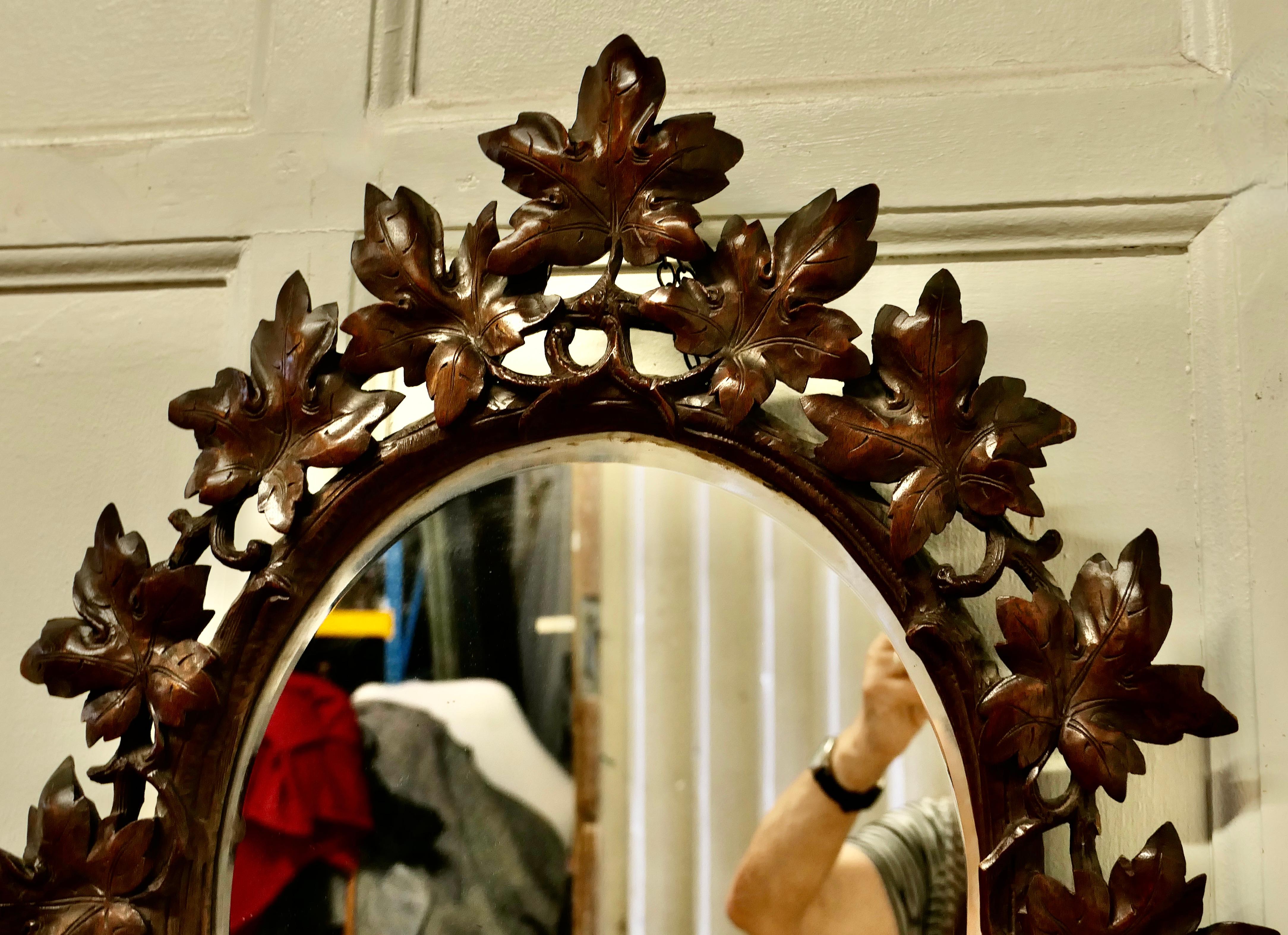 Fruitwood Black Forest Carved Oval Mirror For Sale