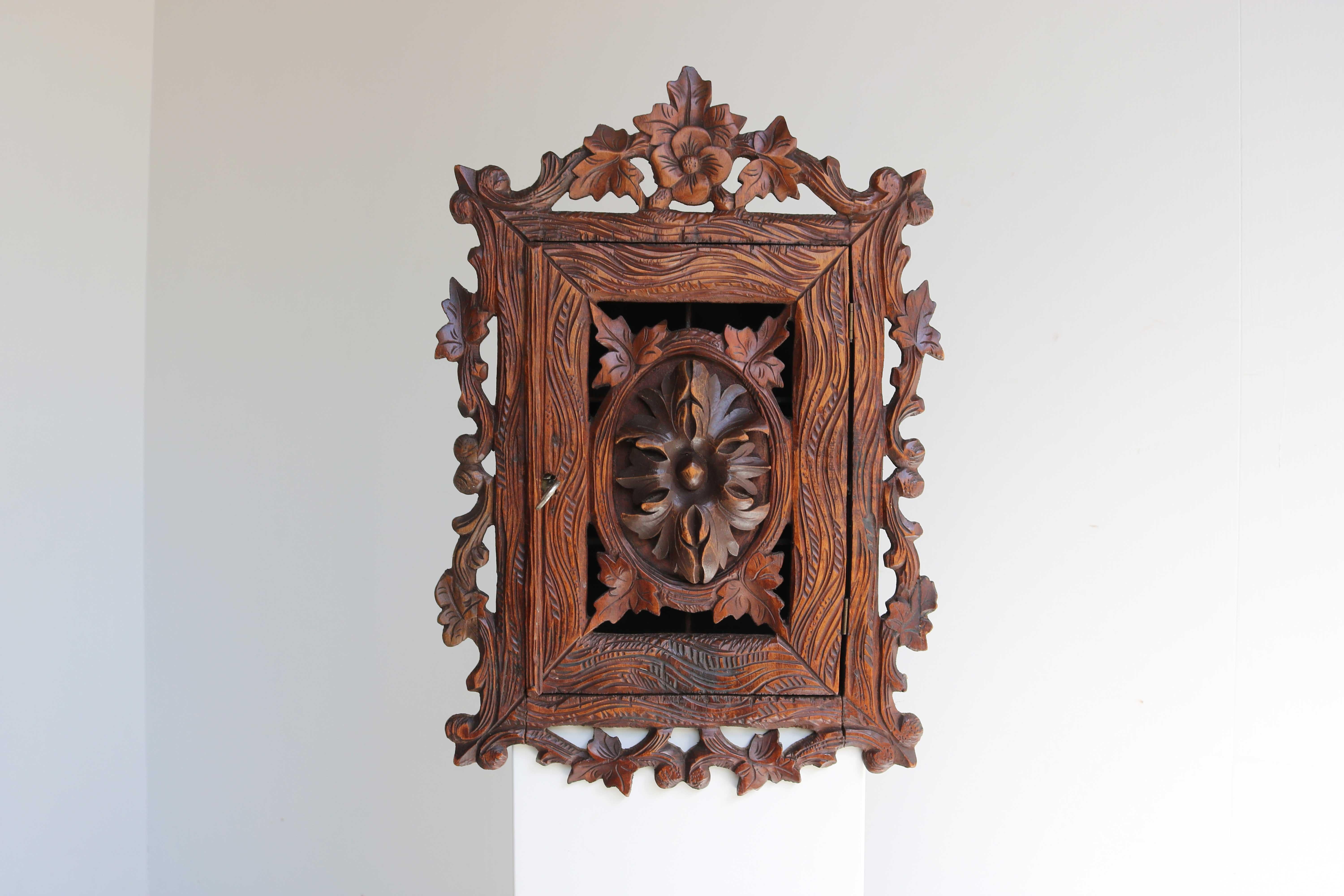 Black Forest carved wall cabinet, Apothecary, Antique Swiss, 19th Century 

Gorgeous little Black Forest antique wood carved wall cabinet, can be used as apothecary or kitchen cabinet. Beautiful hand carved with gorgeous details.
Swiss 19th