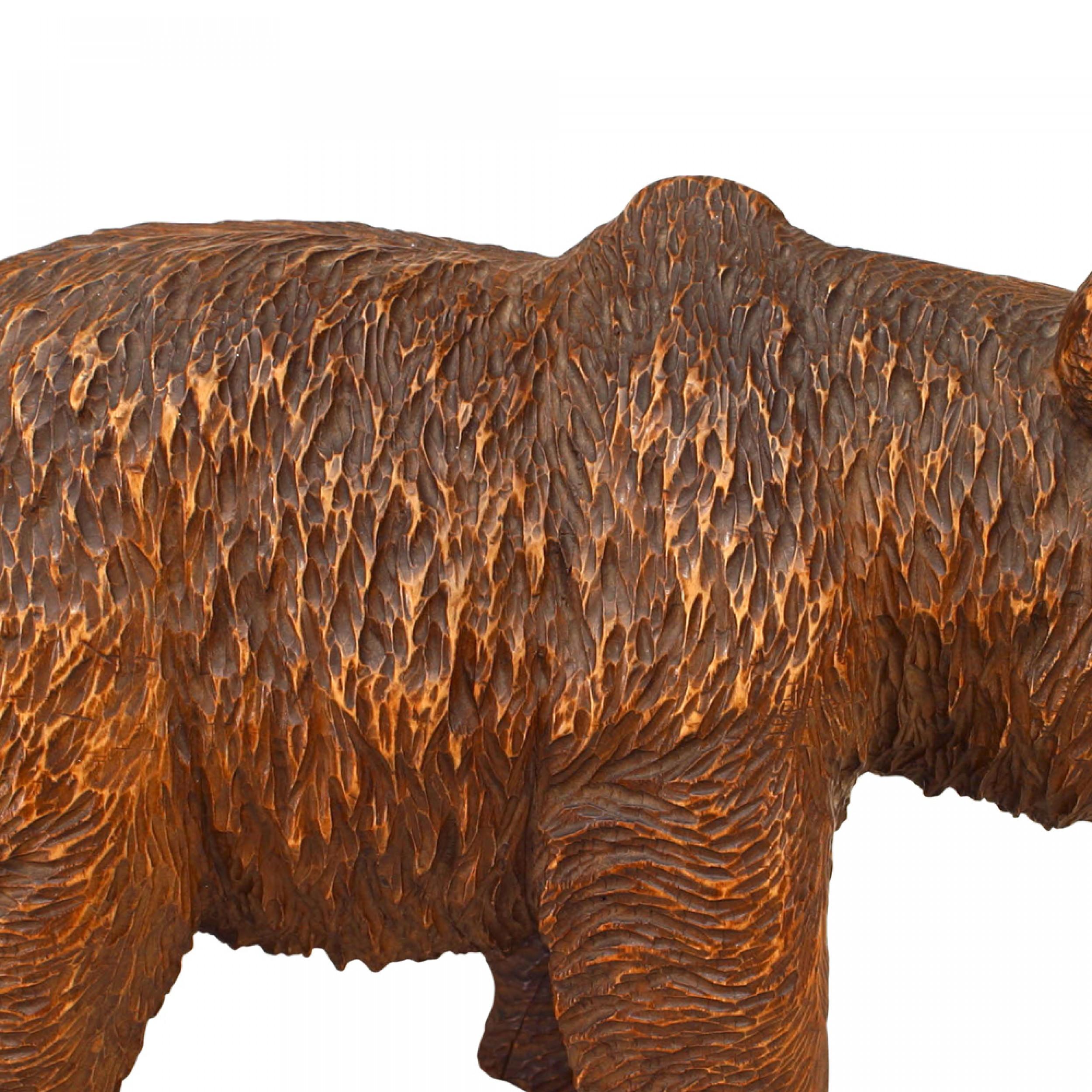 Rustic Black Forest (19/20th Cent) carved walnut small figure of a walking bear with face pointed down. (similar to BAS039A)

Condition: Good; Wear consistent with age and use