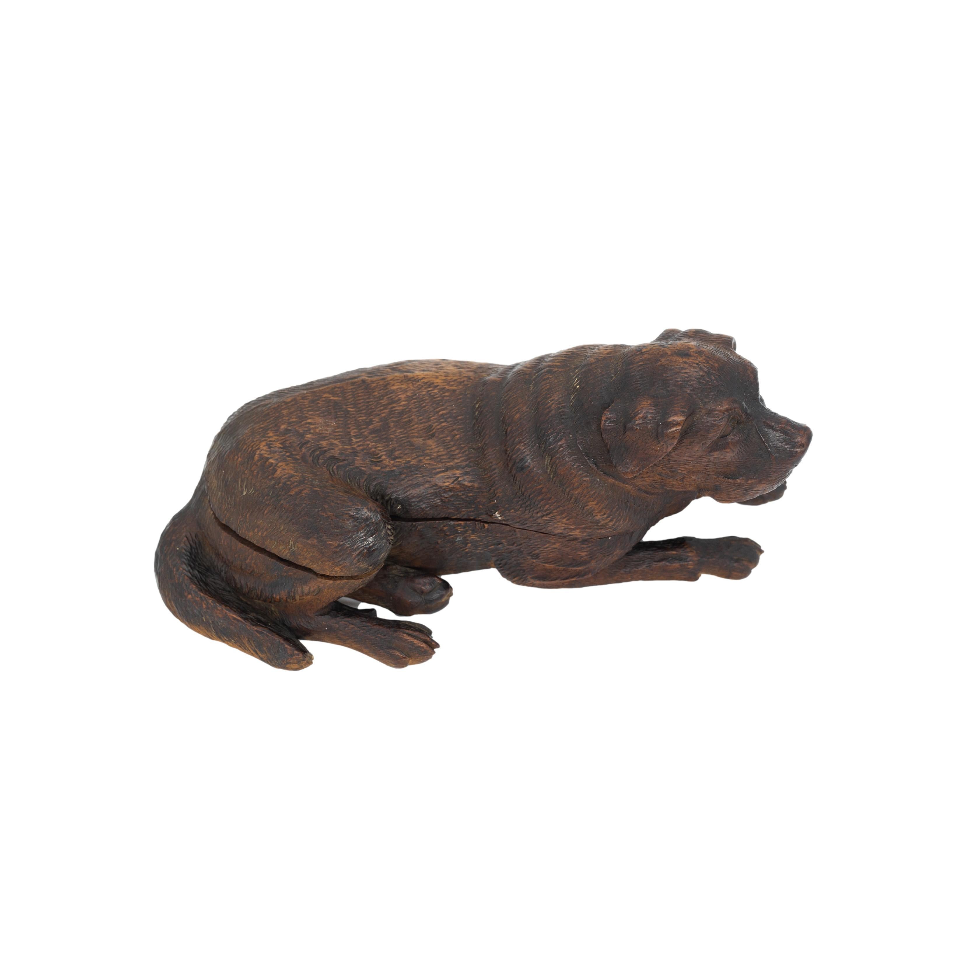 Black Forest Breinzware Walnut Inkwell, carved as a reclining Swiss Mountain Dog, with a hinged top, and two interior glass inkwells, Brienz, Switzerland ca. 1880.  Beautifully detailed and finely carved.  

Jay Arenski, et al, quotes Swiss Poet